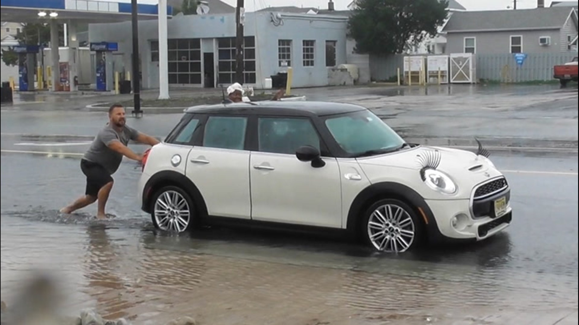 Heavy rainfall from Tropical Storm Fay causes coastal flooding in Wildwood, New Jersey, on July 10, forcing some roads to close. Some cars were seen stranded.