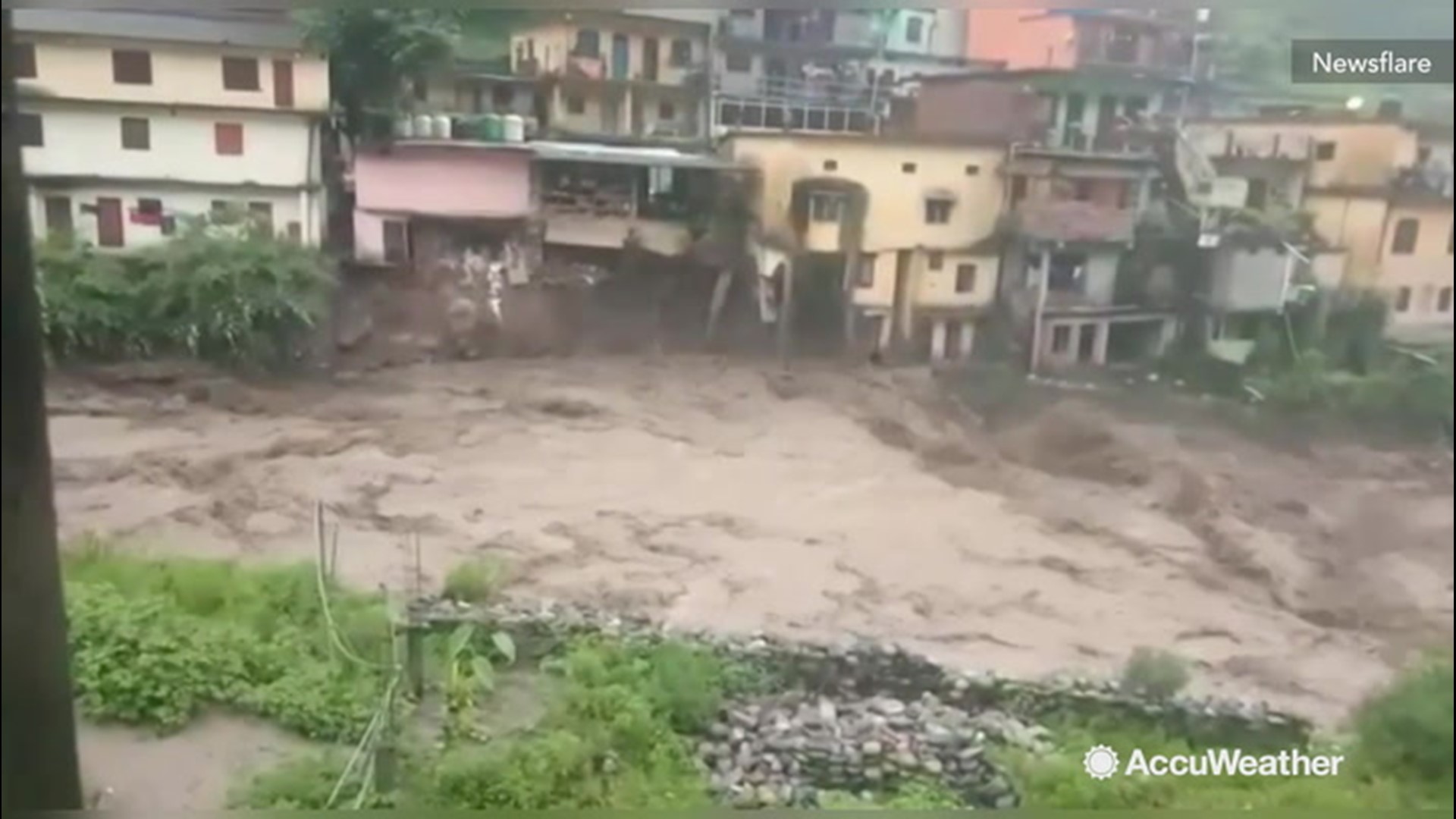 A home collapsed on Monday, Aug. 12, and was washed away by flash flooding in a village in northern India. According to reports, the recent flooding and mudslides have killed scores of people across India.