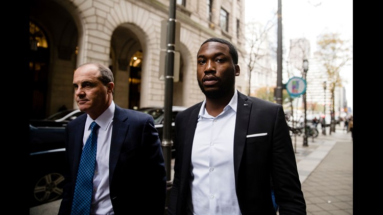 Rapper Meek Mill rings bell at basketball game Rapper Meek Mill rings bell at basketball game