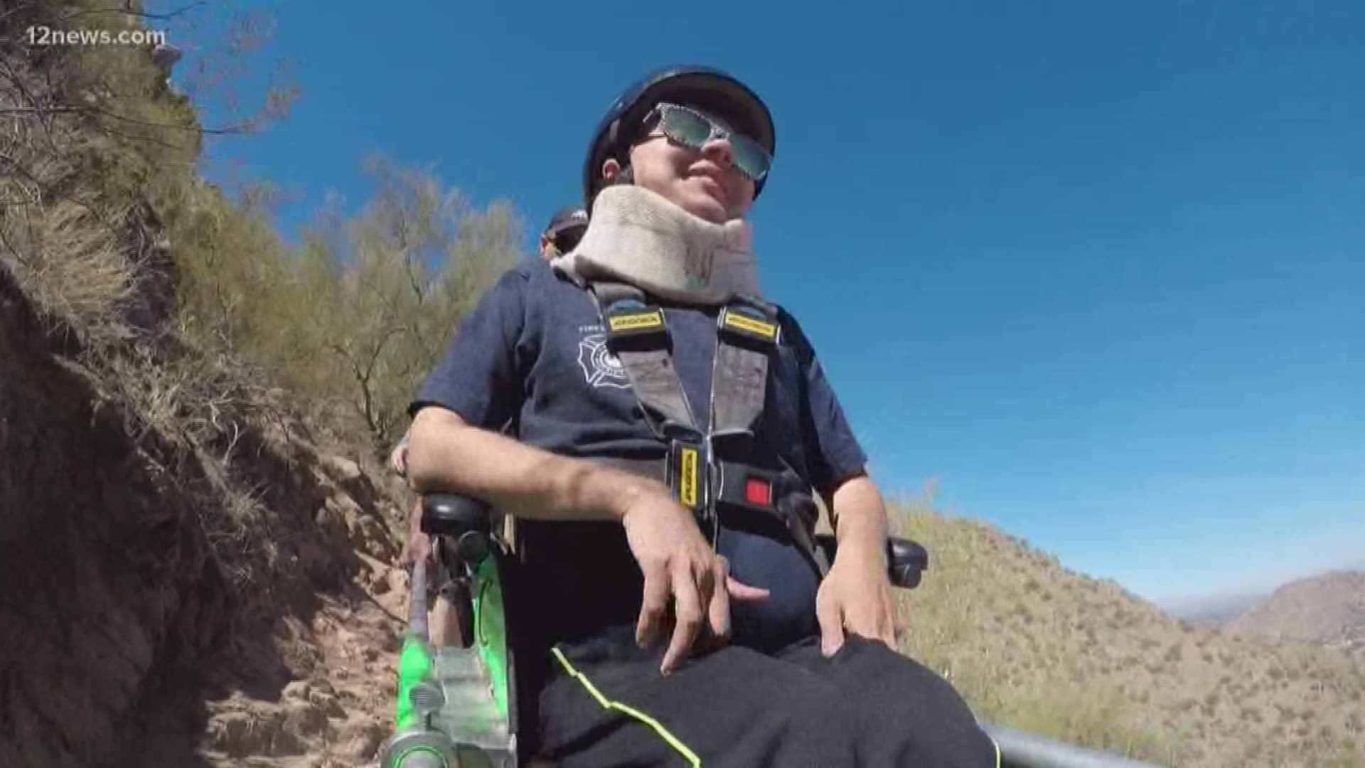 A group of firefighters and volunteers help make a boy with muscular dystrophy's dream come true by carrying him to the top of Camelback Mountain.