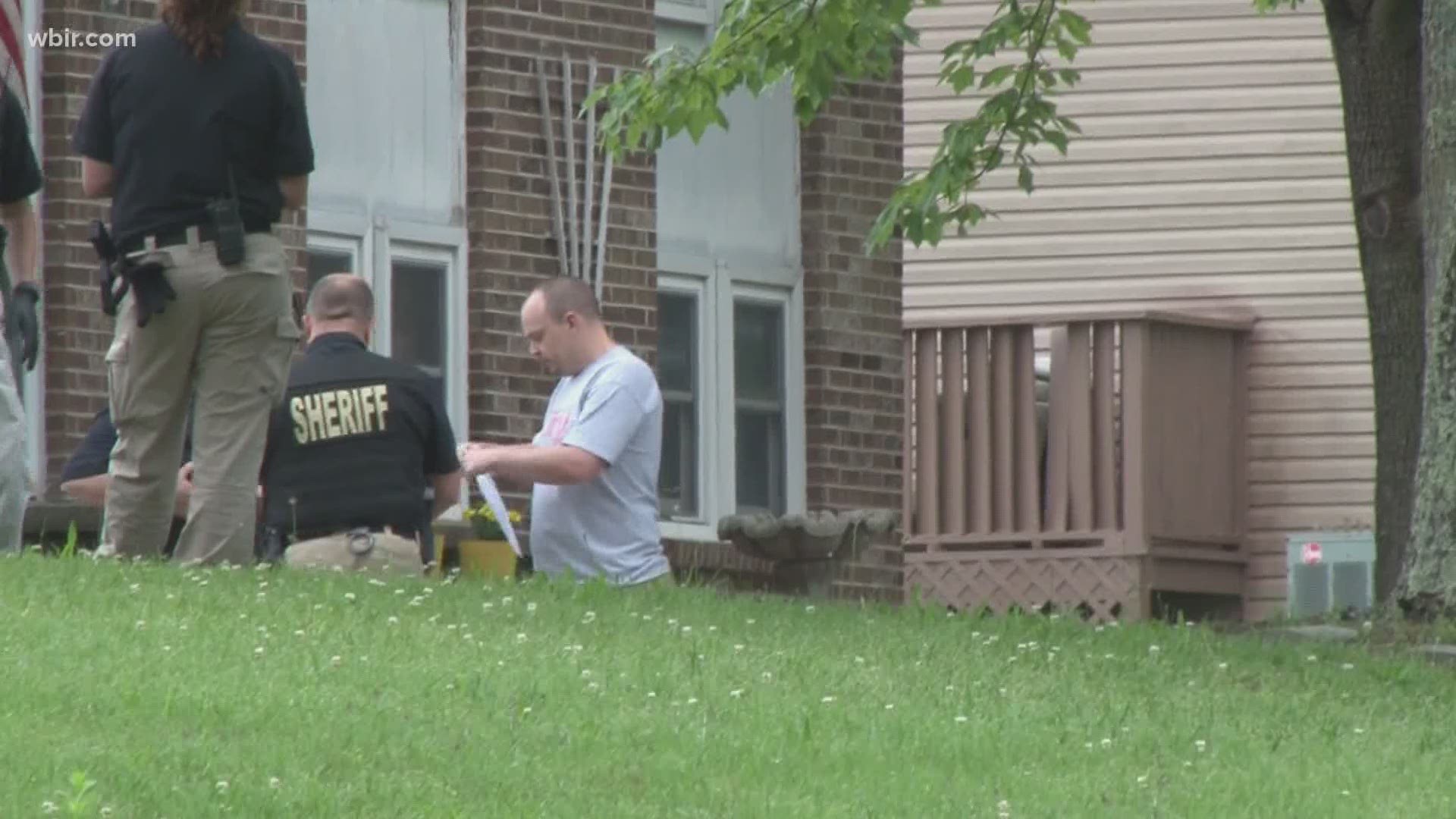 Officers went through the house for six hours, hauling out bags of evidence.