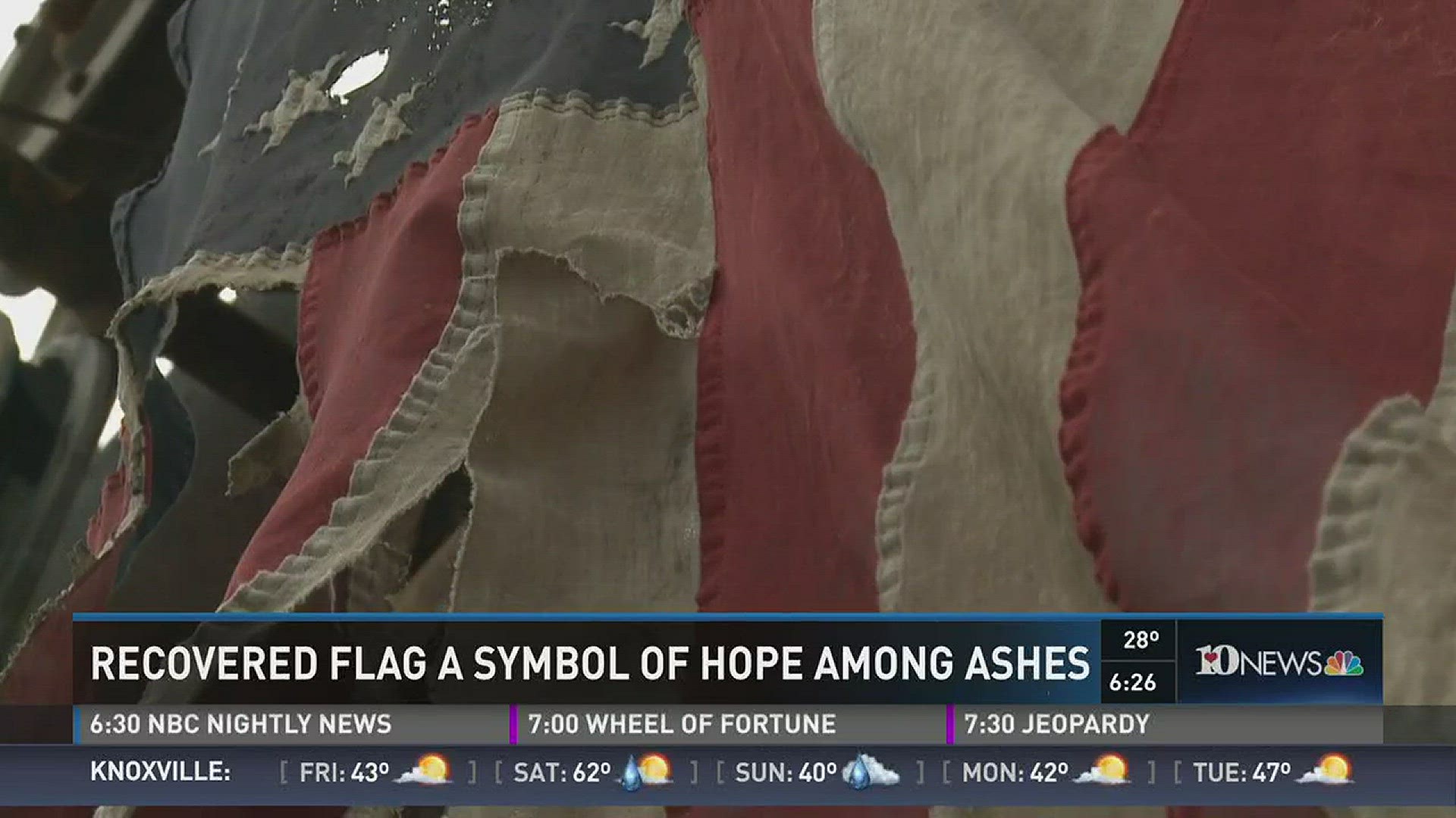 Dec. 15, 2016: An American flag recovered from the remains of the Sevier County fires serves as a symbol of hope among the destruction.