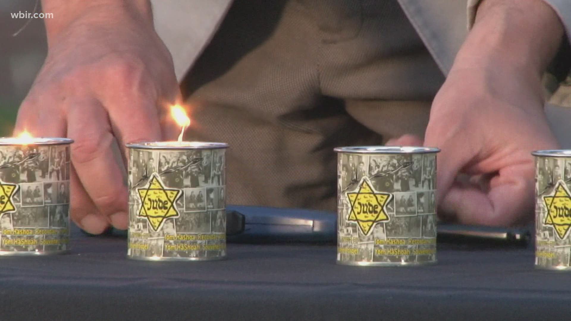 People lit yellow candles to symbolize the Star of David, to honor the six million people killed during the Holocaust.