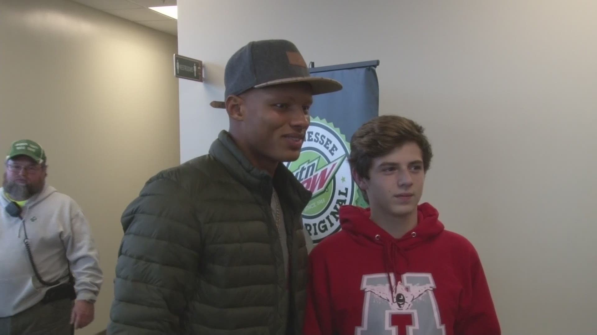UT quarterback Josh Dobbs was among a group from UT to surprise evacuees and firefighters at a Gatlinburg shelter