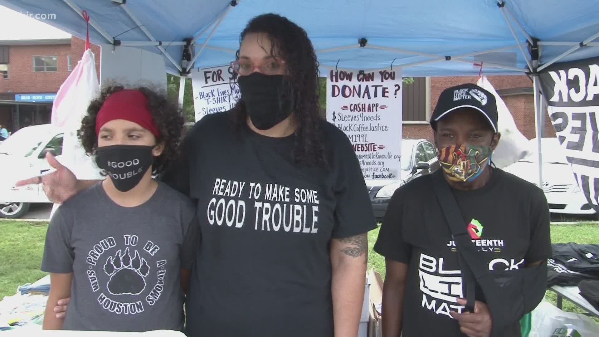 Volunteers started restoring the vandalized "Black Lives Matter" mural in East Knoxville Saturday.