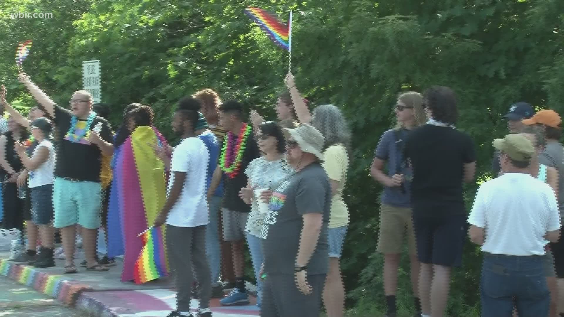 People from across East Tennessee gathered for a community Pride rally in Alcoa after homophobic slurs were painted over Pride art on a well-known bridge.