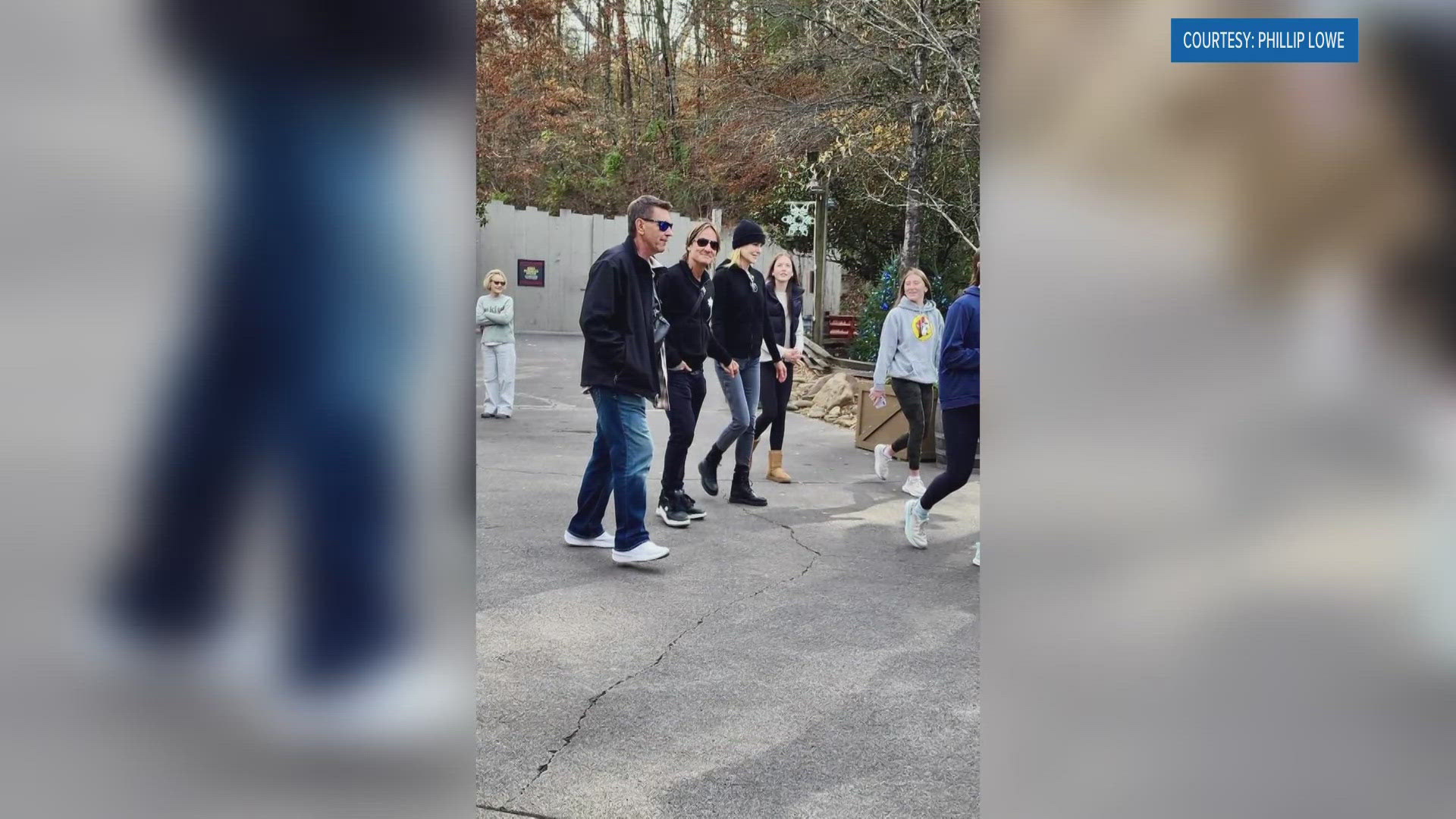 Parkgoers snapped pictures of the couple, who've been married for 18 years, as they smiled for photographs while holding hands.