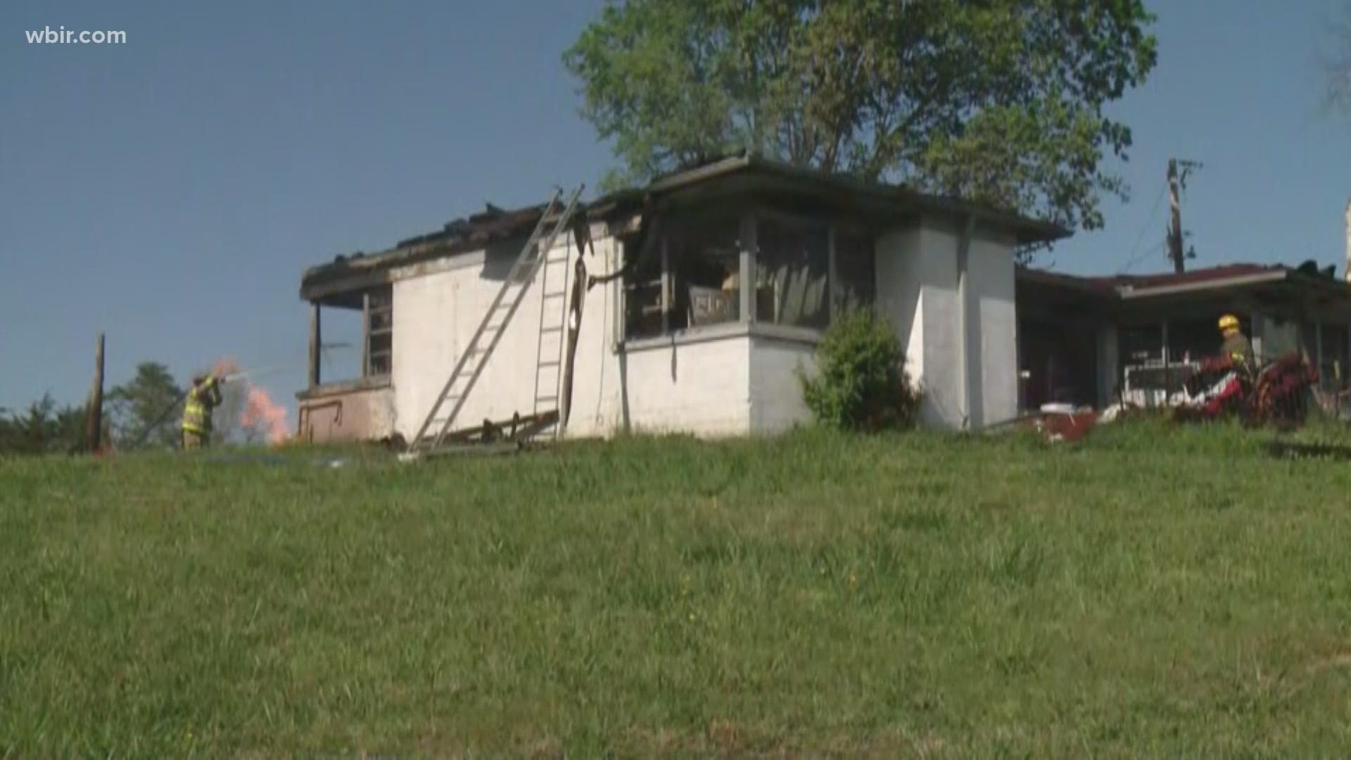 A Rural Metro firefighter is in the hospital after a house fire off Asheville Highway.