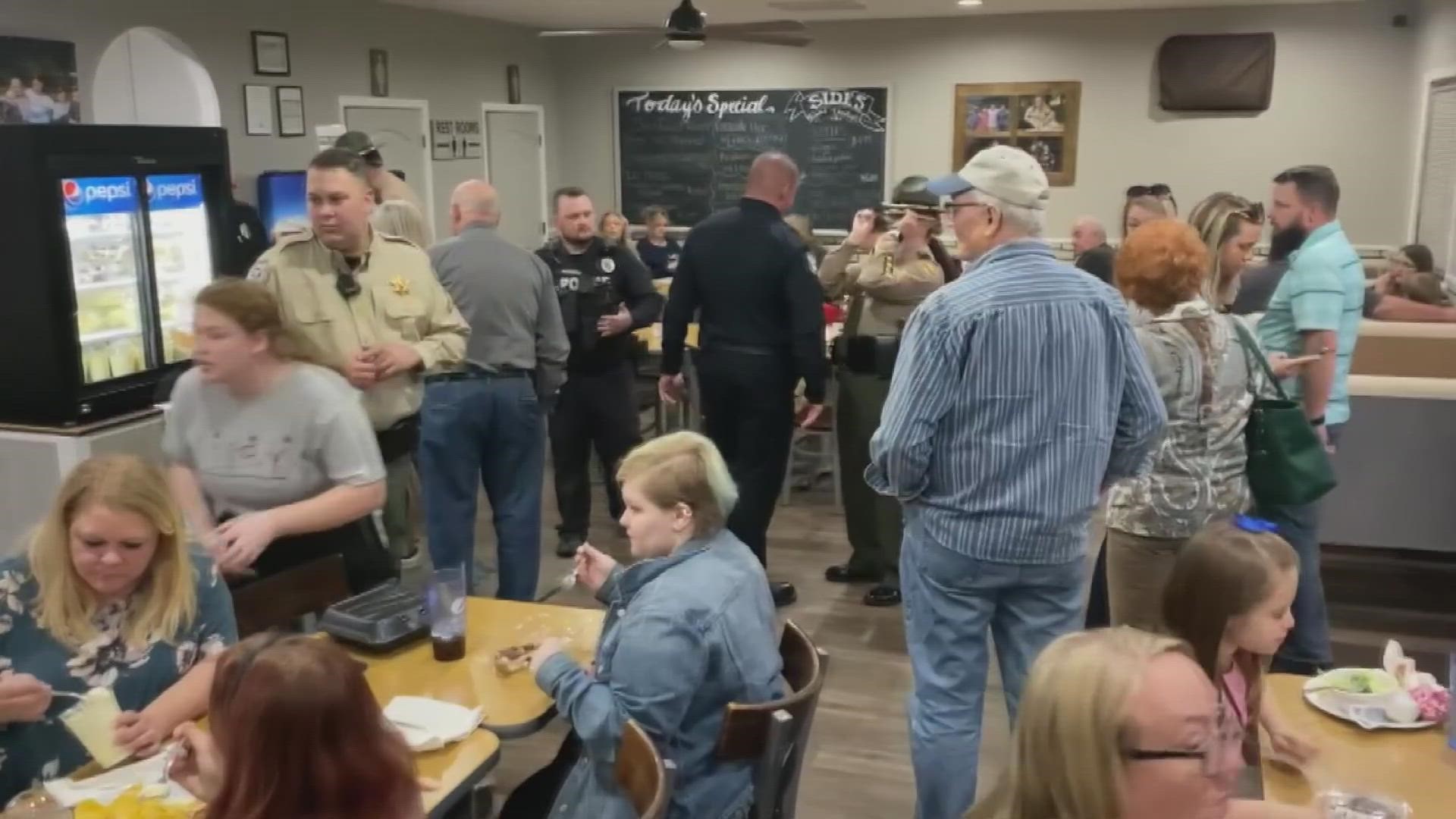 The "Tip-a-Cop" fundraiser invited people to eat at a restaurant and be served by law enforcement officers.
