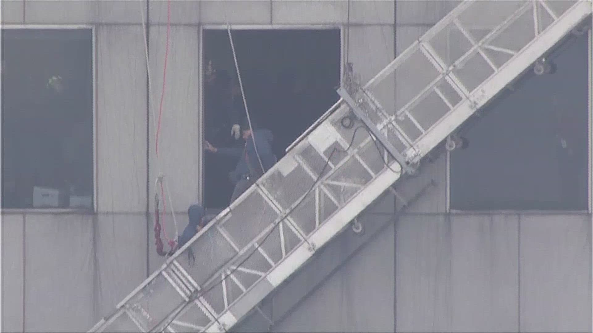 Firefighters rescued window washers stranded 71 floors above downtown Houston. (Video: NBC/KPRC)