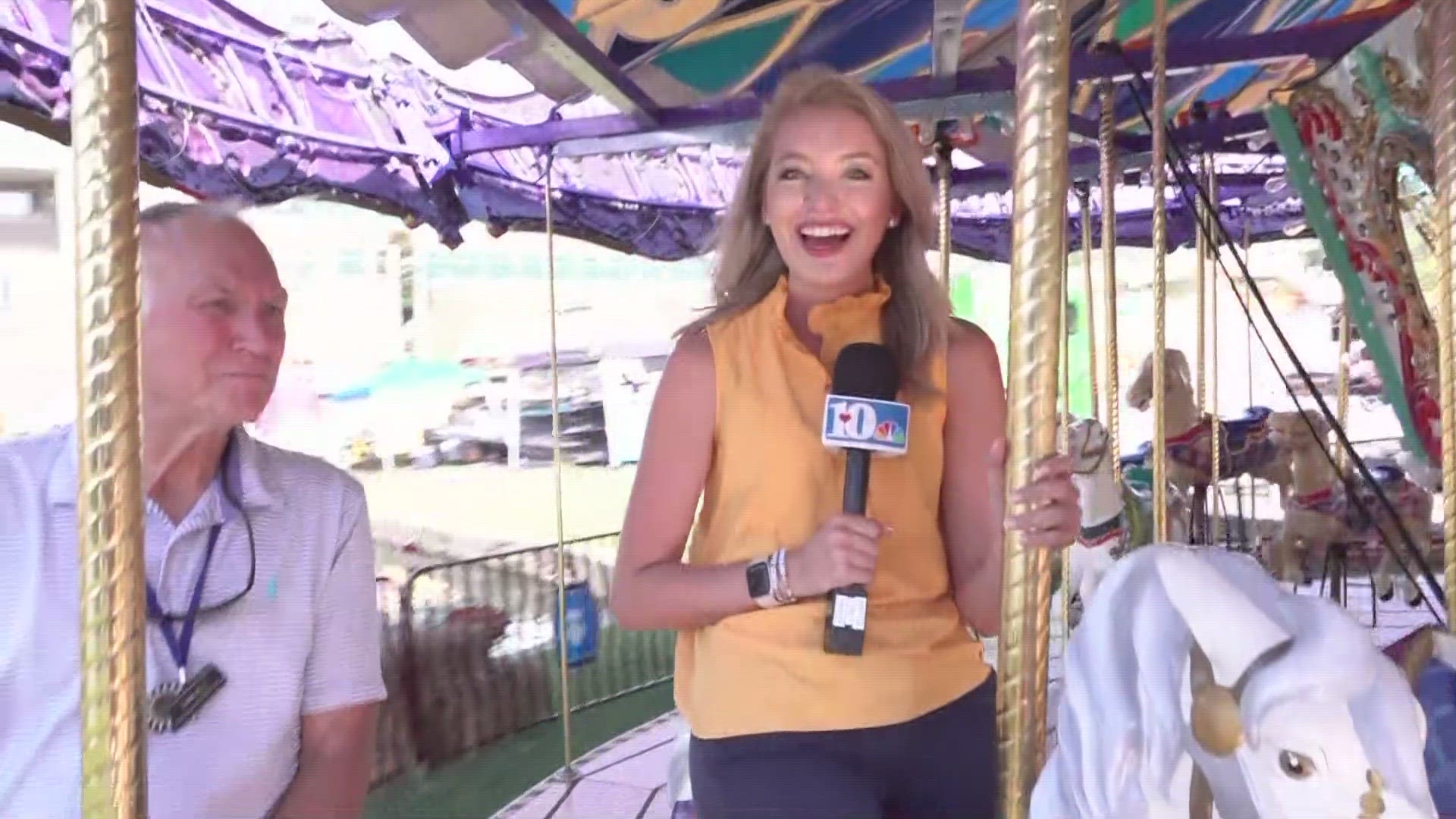 10News' Katie Inman hitches a ride on the carousel before the fair ends for the year.