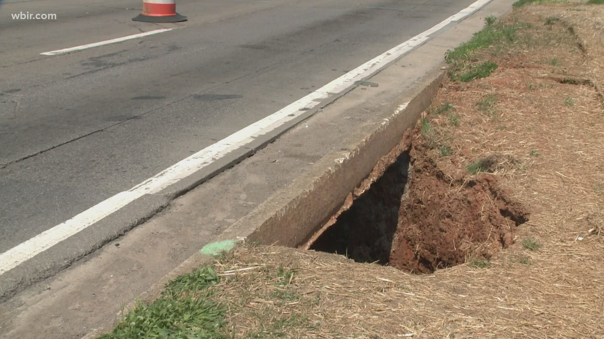 A failed storm sewer pipe on the eastbound side of the road created the hole.