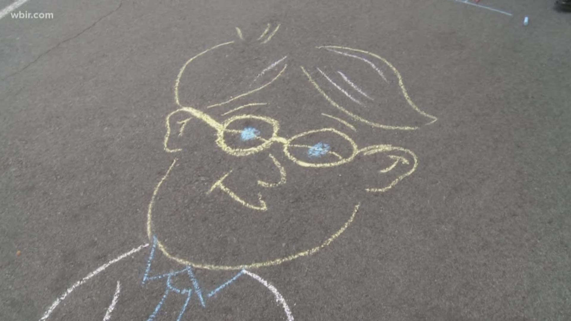 The Live at Five at Four crew had a one minute competition to draw the best piece of art they could with chalk, ahead of the Dogwood Arts Festival's ChalkWalk on Saturday. Date: April 19, 2018