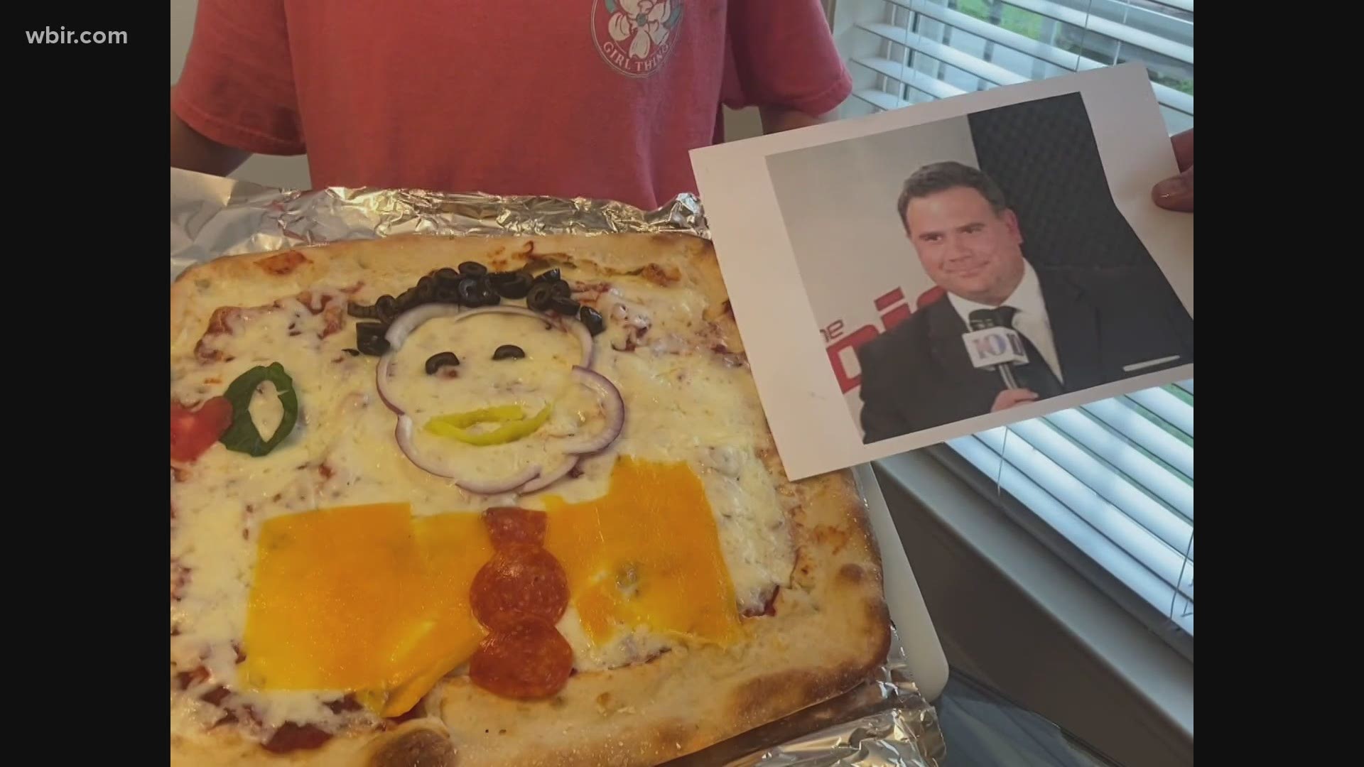 Jay Bernard with Metro Pizza and his daughter Stella make a pizza to look like Russell Biven. April 1, 2021-4pm.