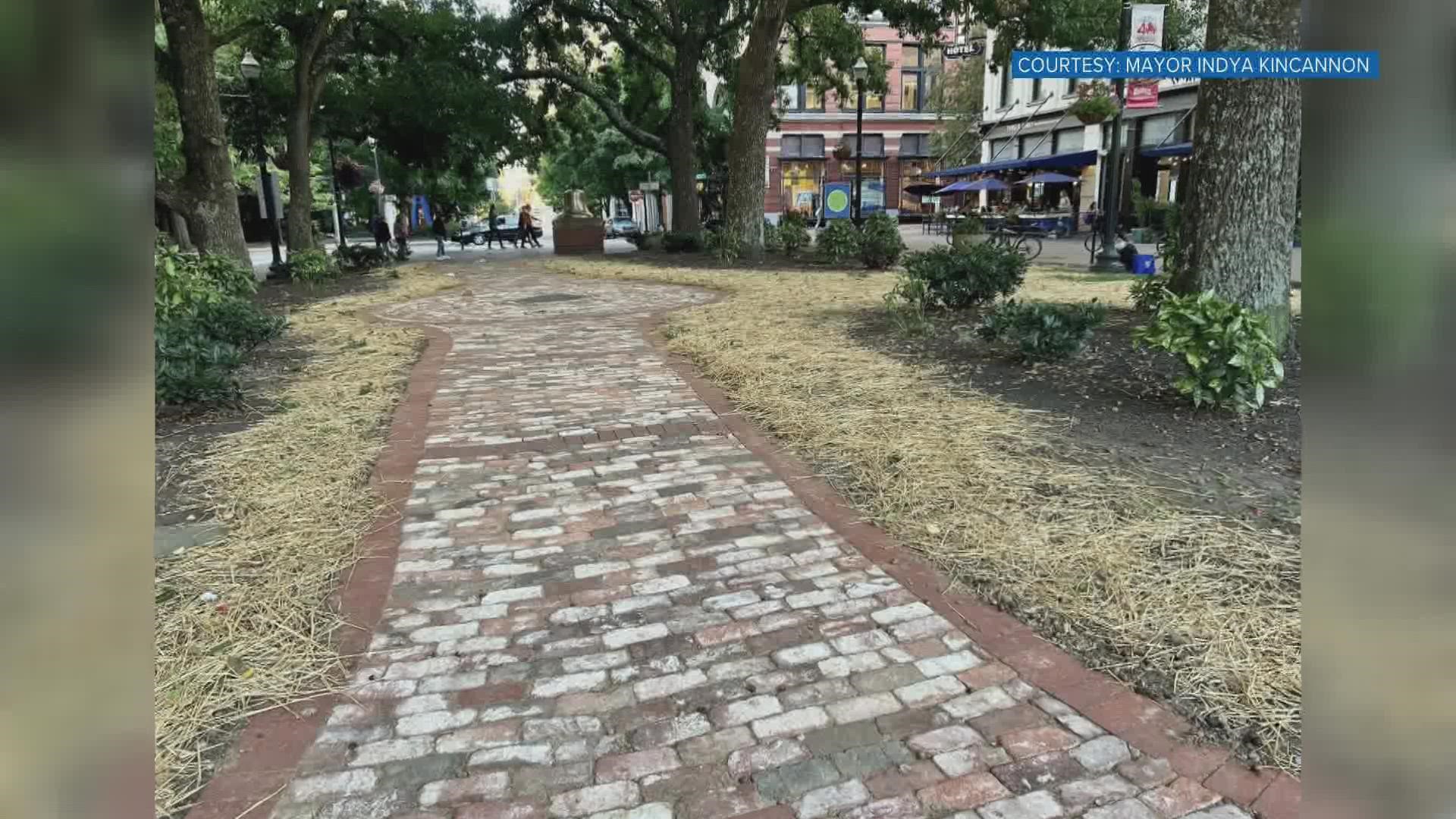 A new Market Square walking path includes bricks dating back more than 100 years old.