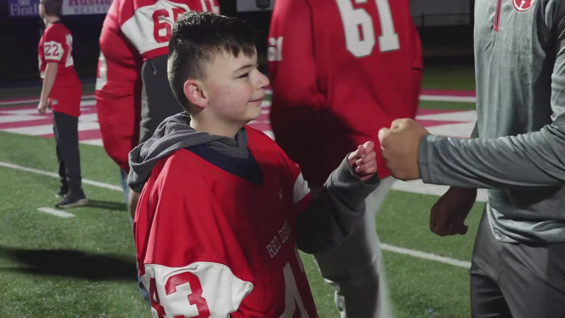 Teachers, football players, cheerleaders and parents got together to create a Friday night football atmosphere for students with disabilities.