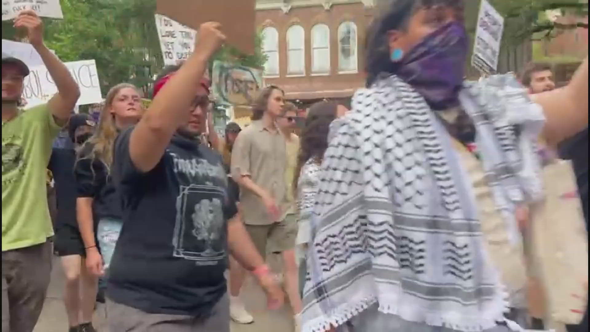 Protestors carried signs and flags, calling for an end to aggressive immigration sweeps and deportations.