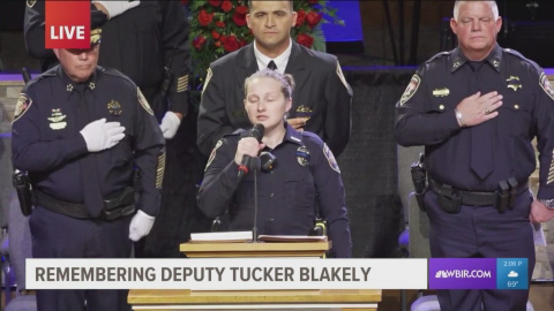 BCSO Deputy Shelby Eggers singing National Anthem at KCSO Deputy Tucker