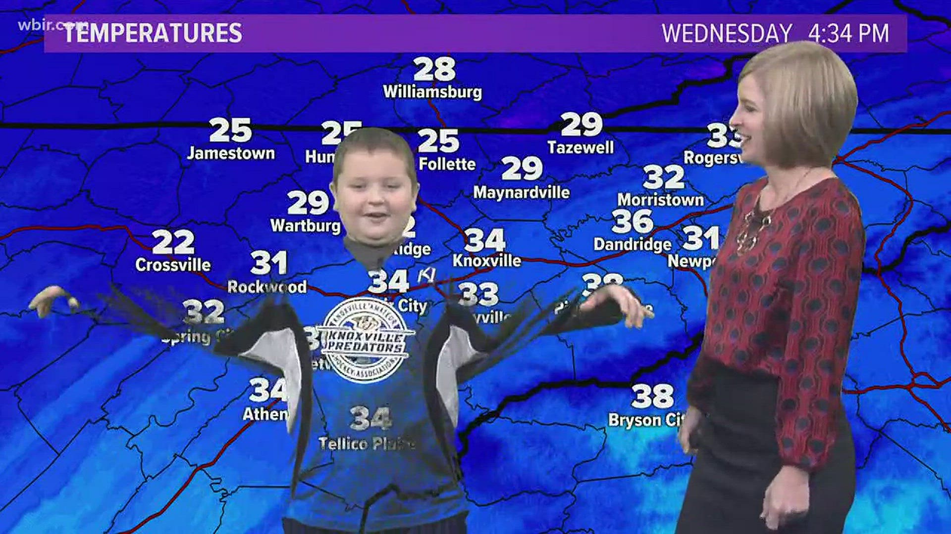 A moment when Eli keys out on the weather wall. Cassie warned him that green and the weather don't mix.