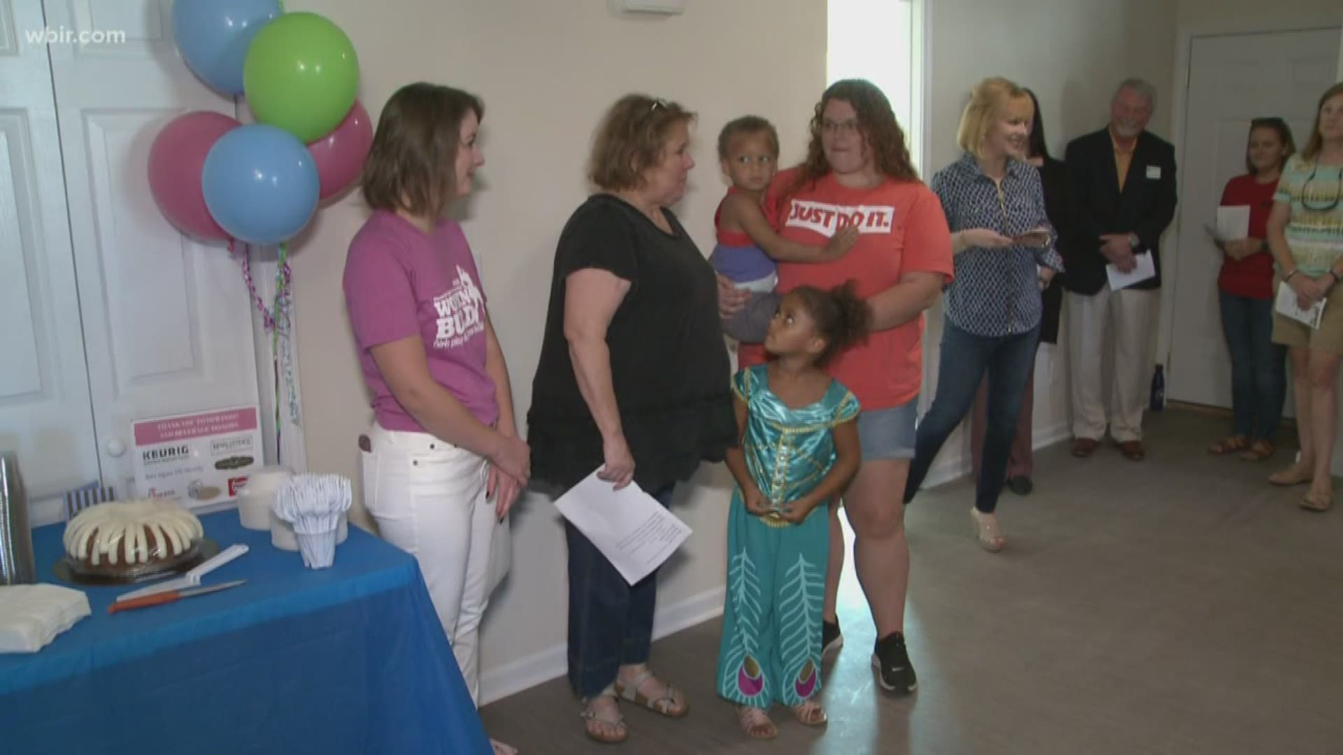 A family received the keys to their new home built in part by a female Habitat for Humanity crew earlier this summer.