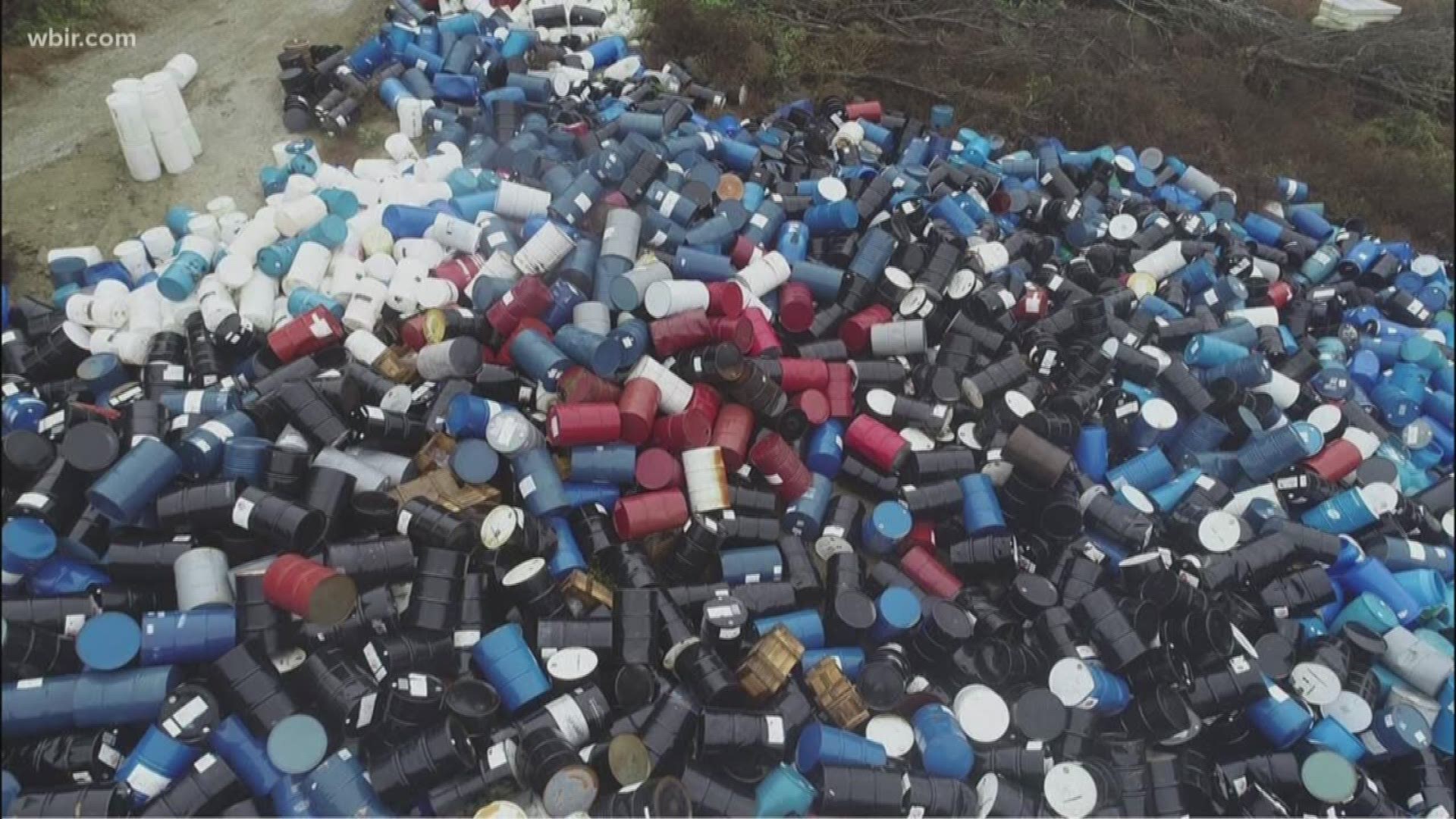 Some of the barrels have leaked into a nearby creek and onto other property west of Norris Dam.