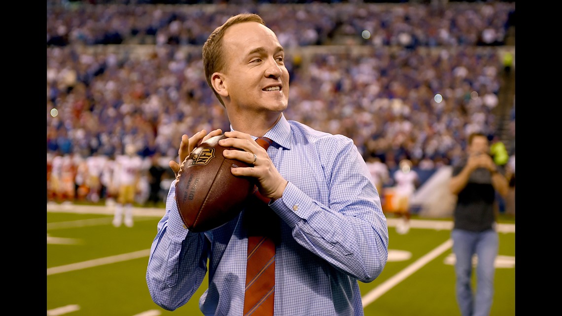 'Peyton's still got it' Peyton Manning throws pass to Mascot Rocky