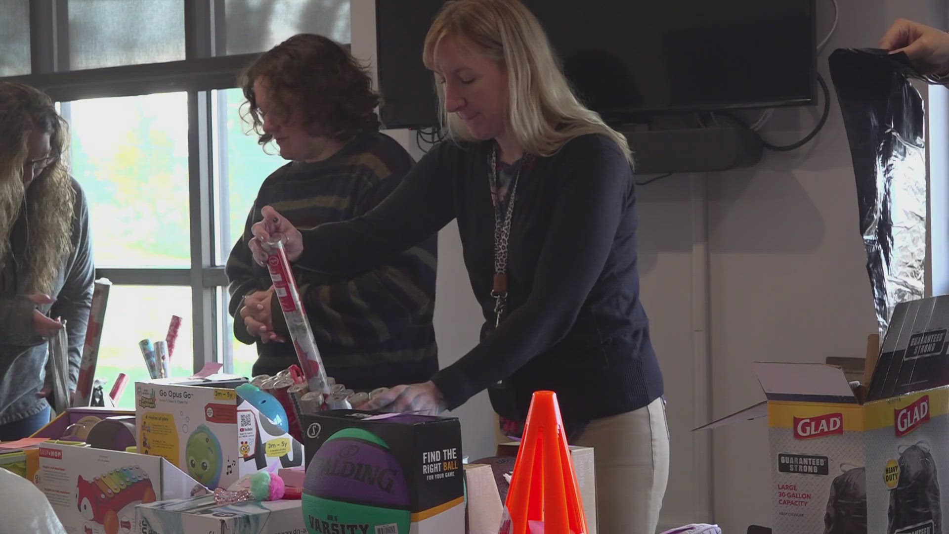 During the event, they give out bags filled with hygiene products, cleaning supplies, other essential items and a gift card for a holiday meal.