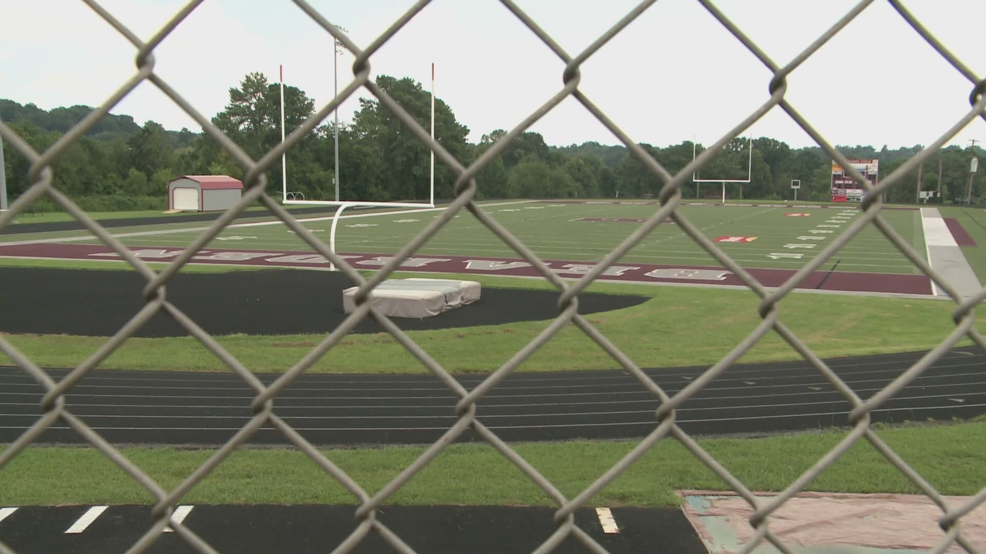 The school announced it will stop football practices and cancel games until August 31.