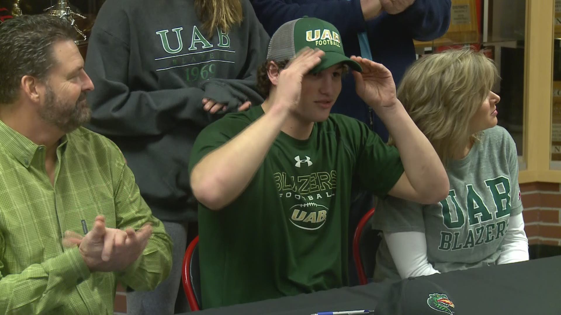 Maryville quarterback Dylan Hopkins signed early with UAB, but celebrated on National Signing Day with his teammates.