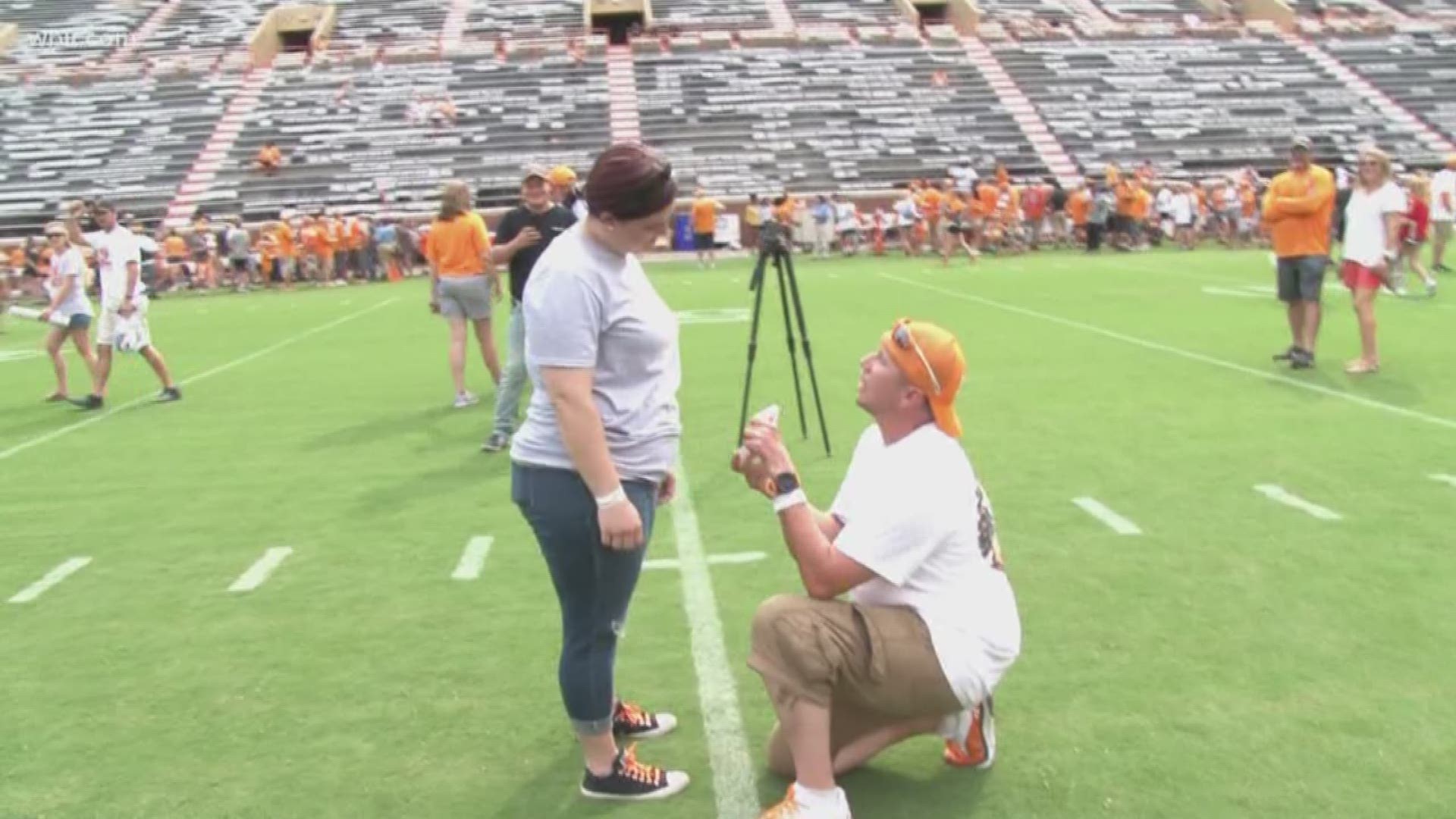 At UT's Fan Day, a Tennessee fan asked his girlfriend to marry him on the 50 yard line at Neyland Stadium