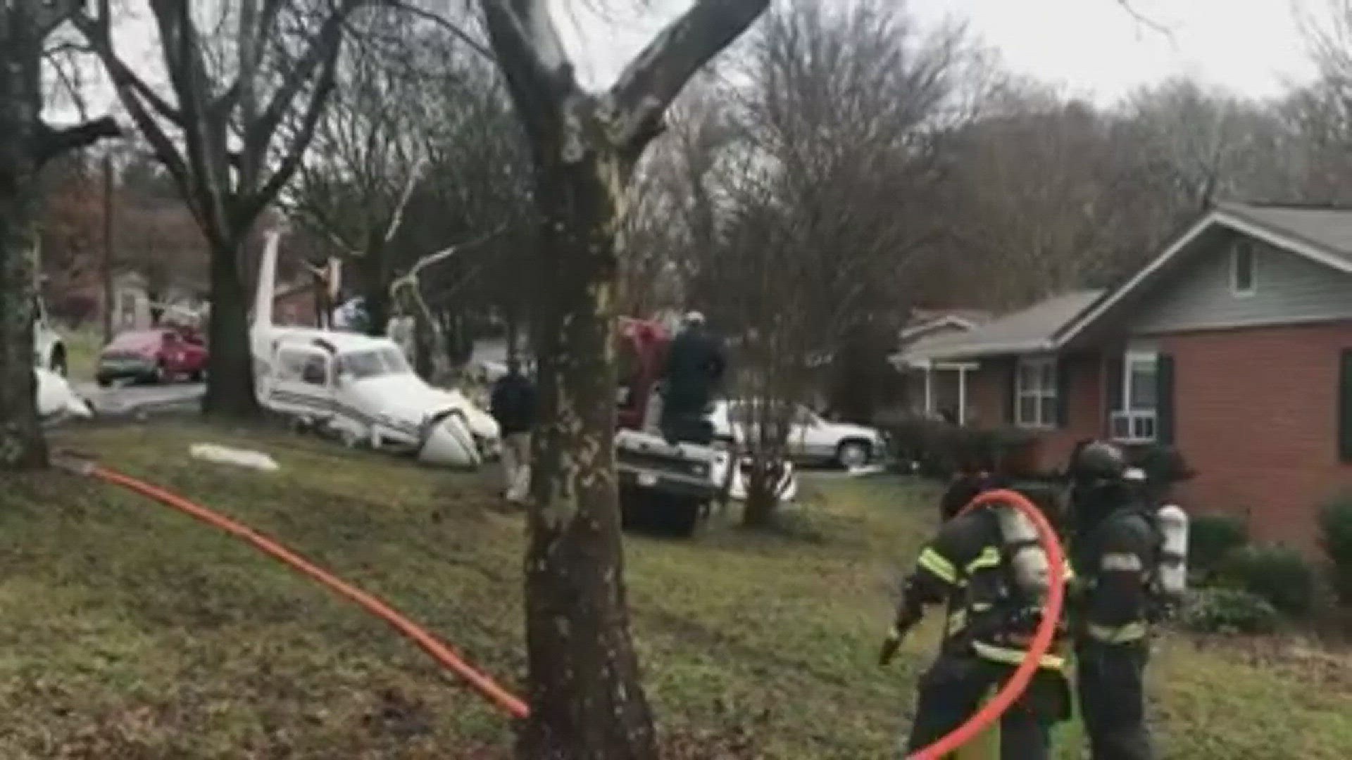 The small plane crashed on top of a car parked in a driveway, not far from Island Home Airport.