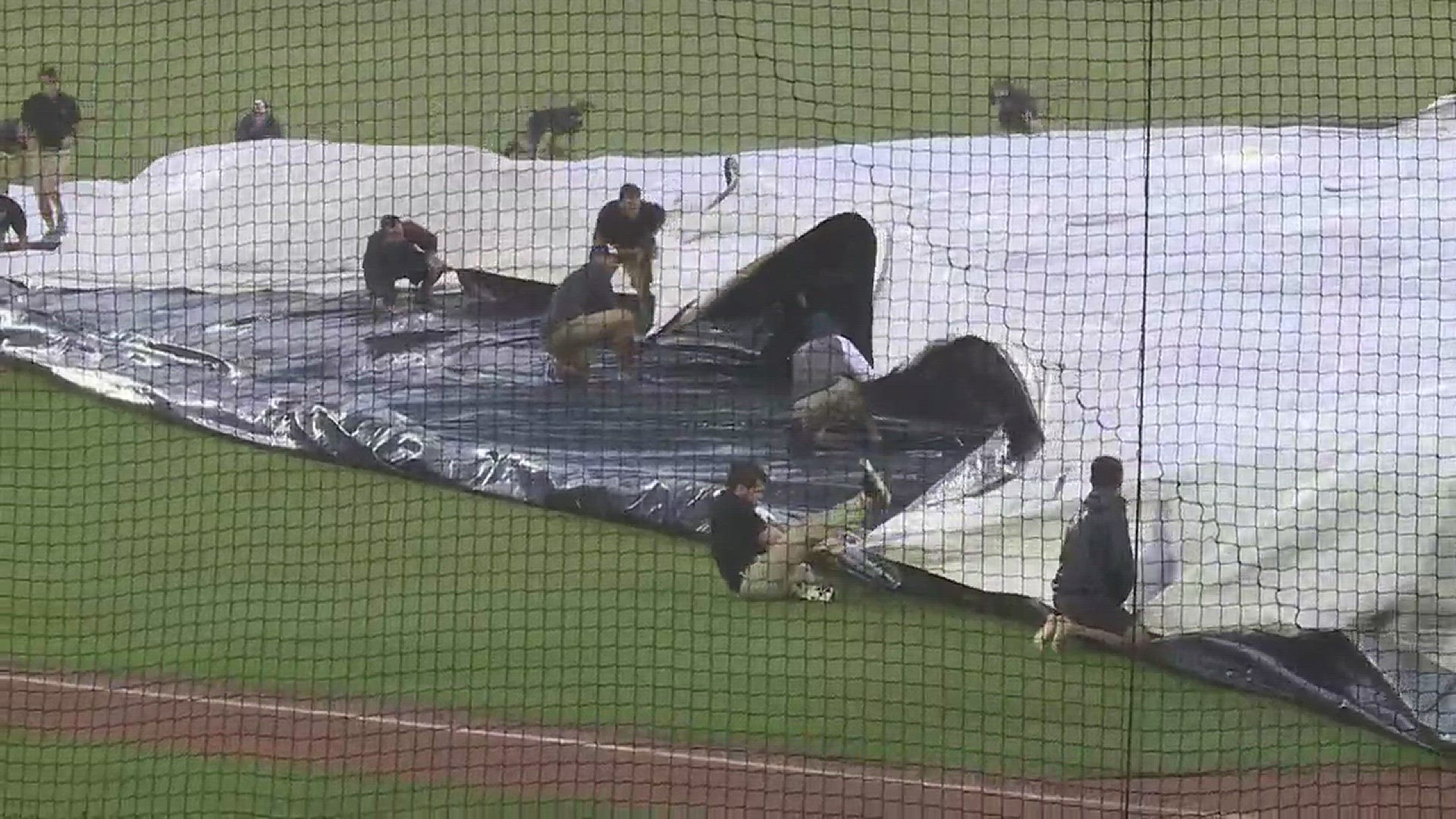Storms caused the Cubs' Double-A affiliate, the Tennessee Smokies, to suspend their game with Jackson. The grounds crew had a hard time getting the tarp on the field amid heavy rain and high winds.