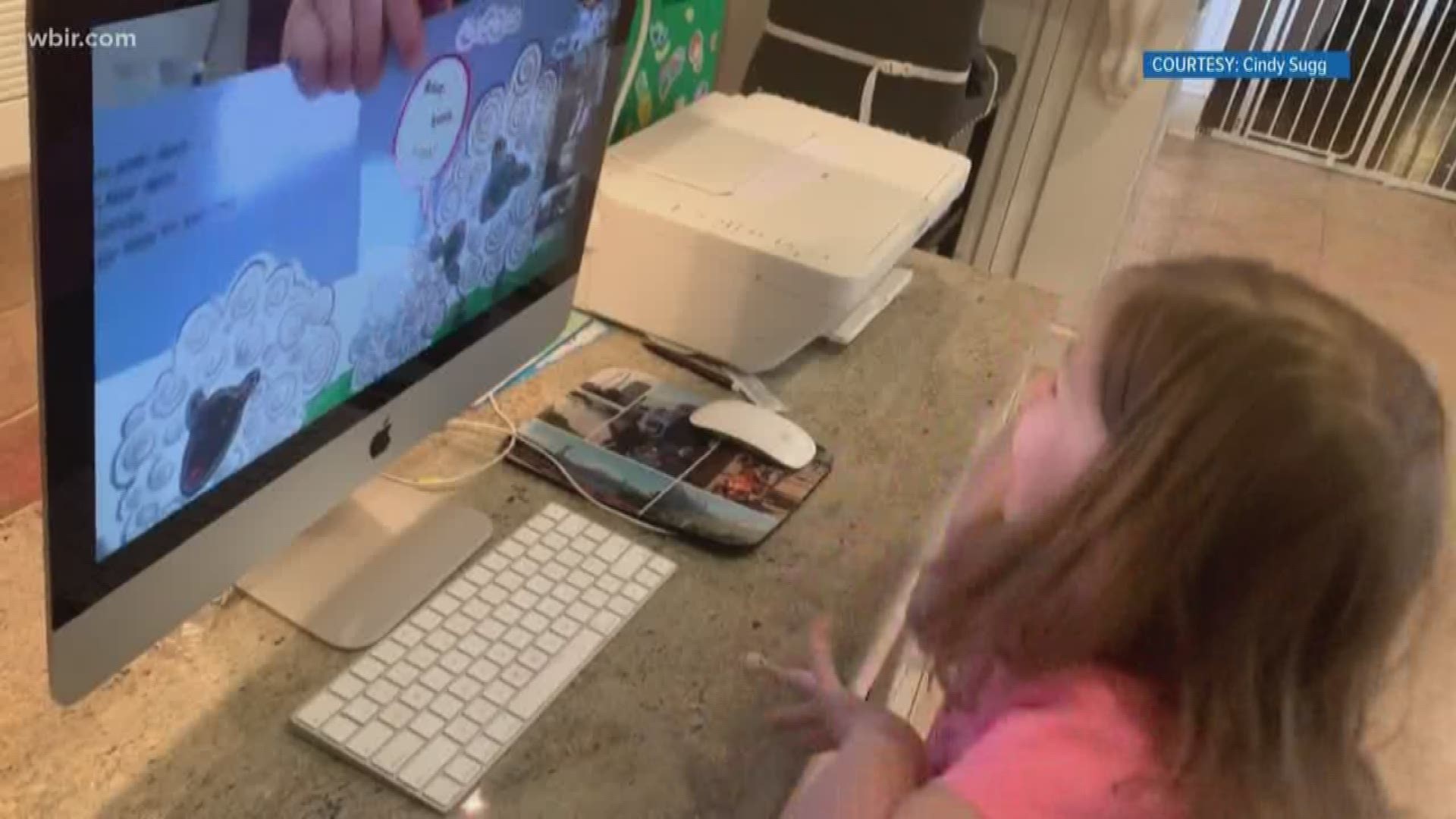 Computer screen fills with lots of happy faces when Kindermusik moves to Zoom