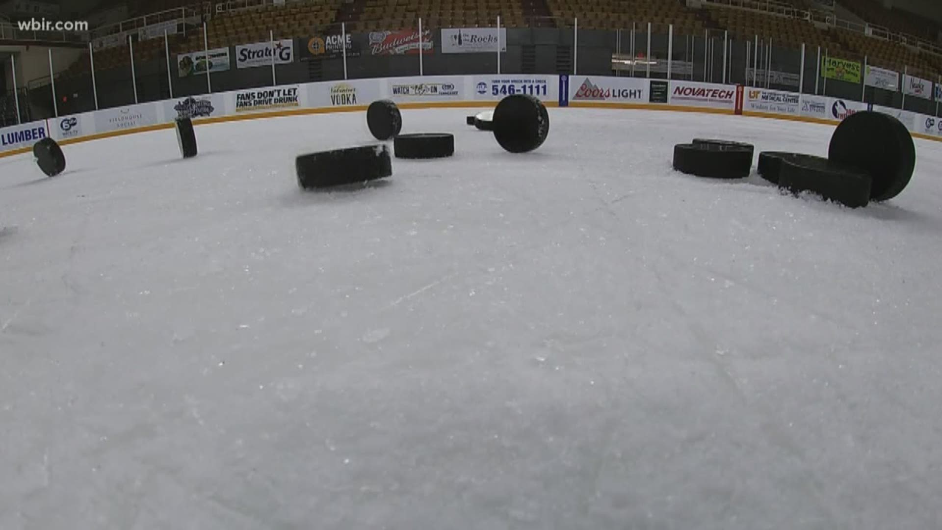 10Sports Anchor Patrick Murray shoots some pucks at the Civic Coliseum with Ice Bears leading scorer Anthony McVeigh.