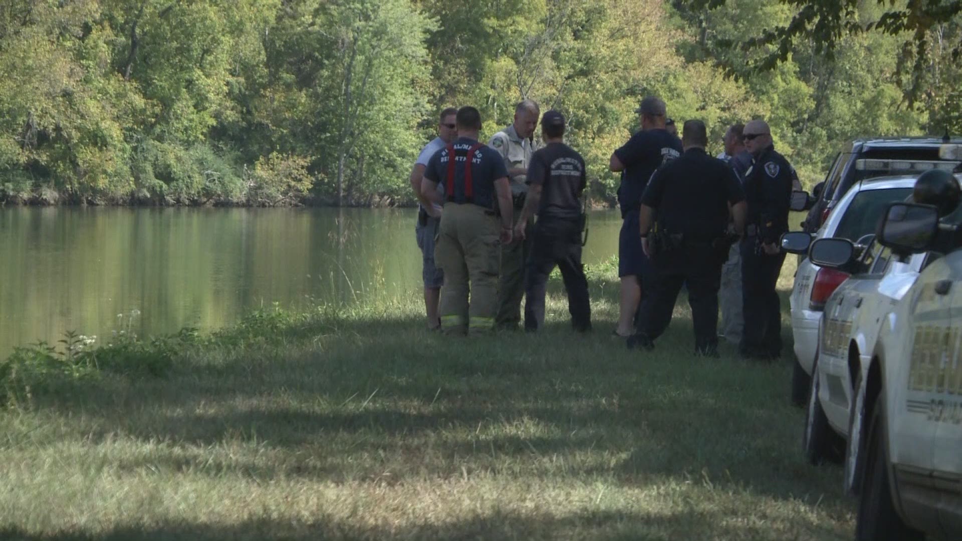 Two people were hurt when their plane clipped a power line and crashed into the French Broad River.