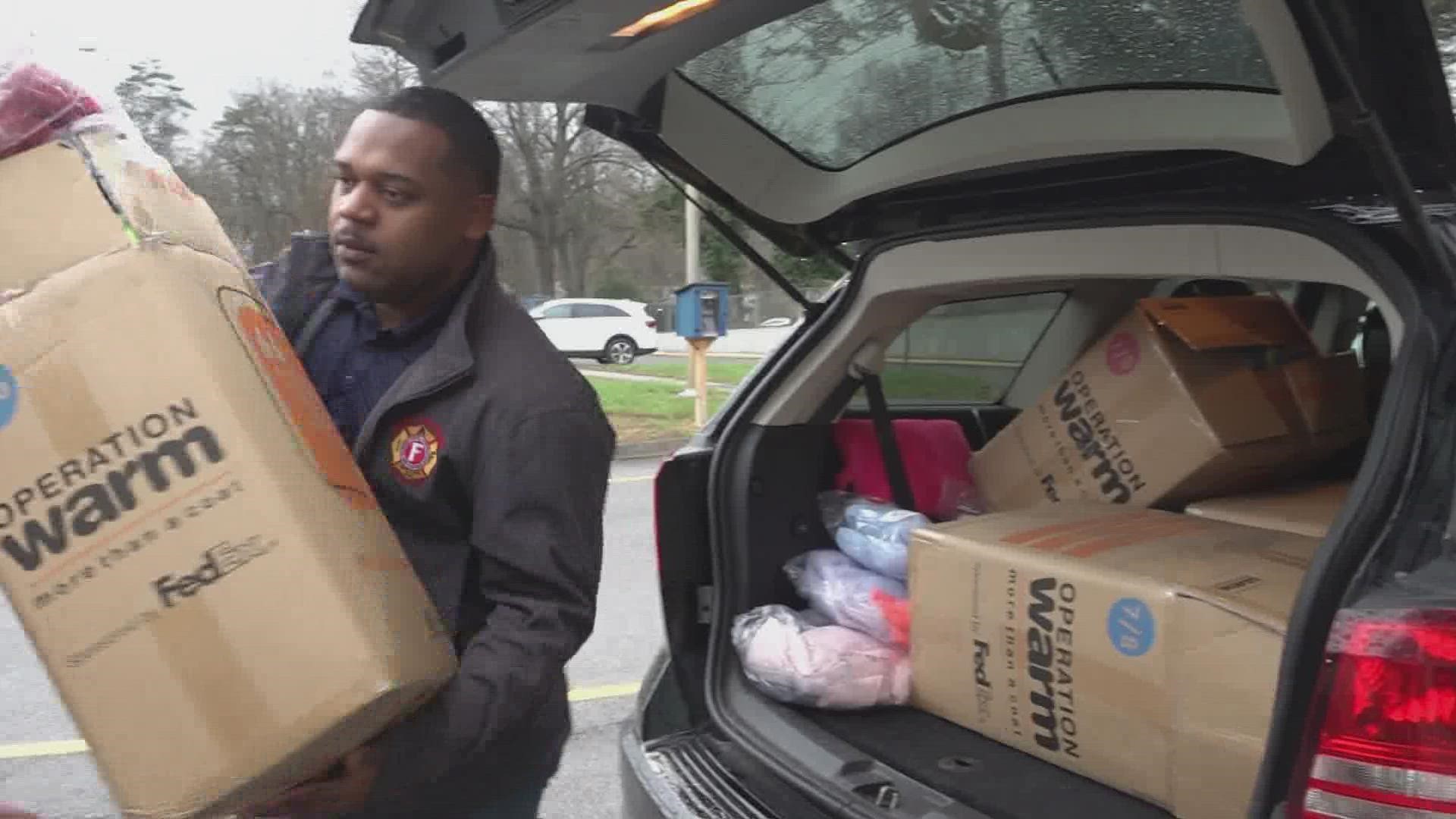 Firefighters unloaded the cars, giving around 350 coats to children at seven schools across Knoxville.