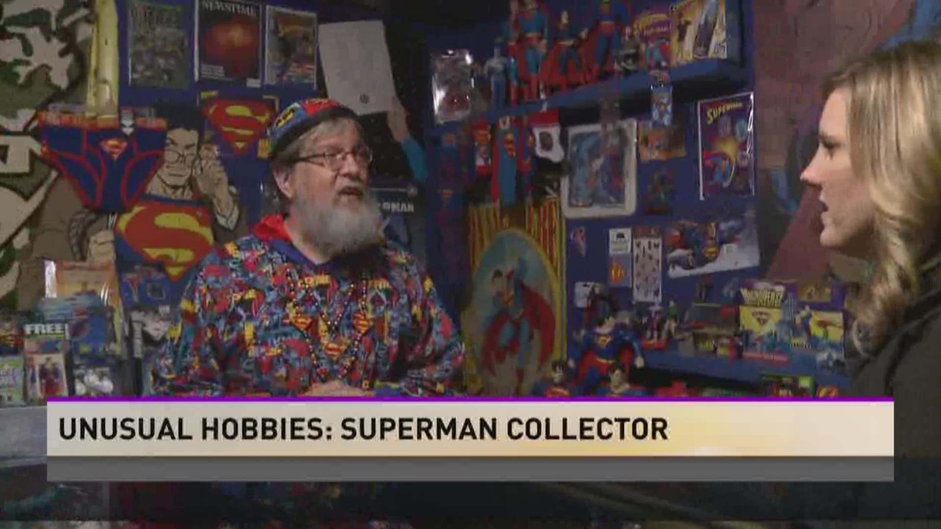 Two rooms of one man's house are filled with his Superman collection.