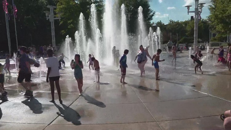 Families celebrate Festival on the 4th at World's Fair Lawn, and cool down near splash pads