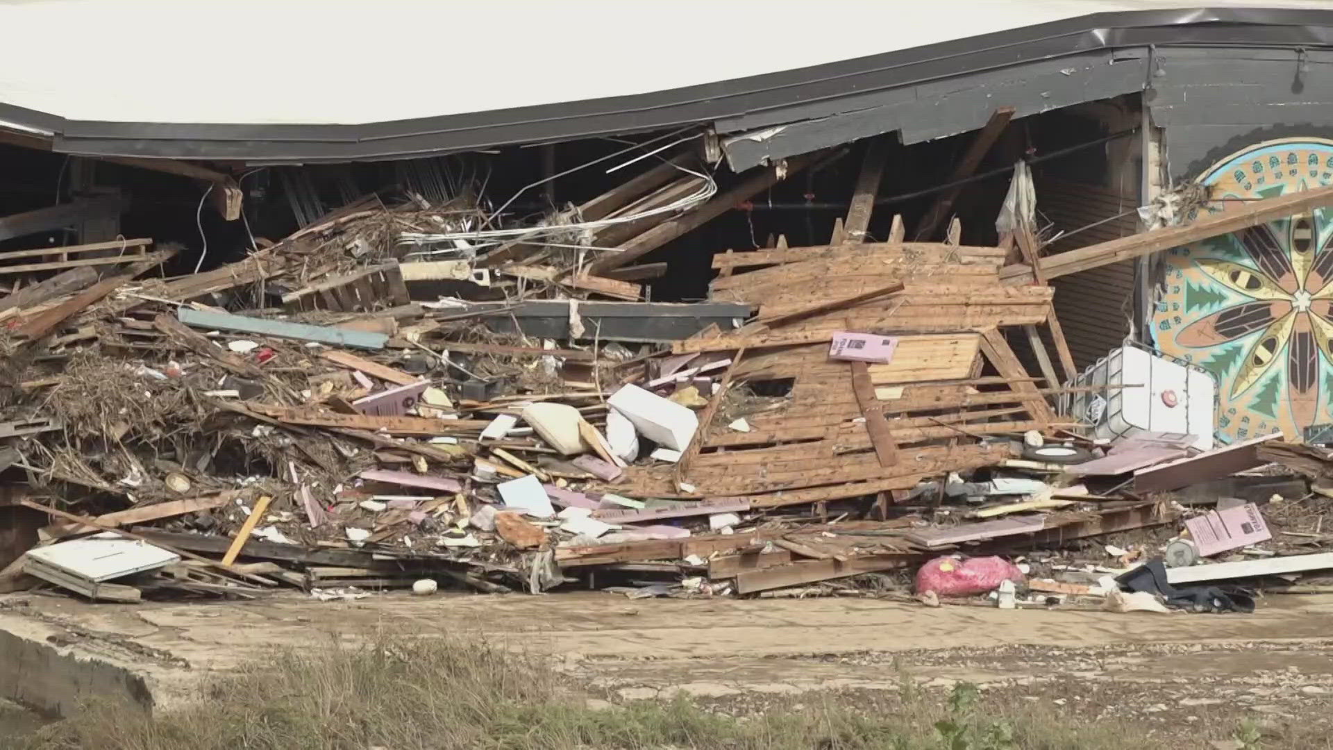 Hartwell Carson said he's seen propane tanks floating by in the French Broad after devastating flooding in the area.