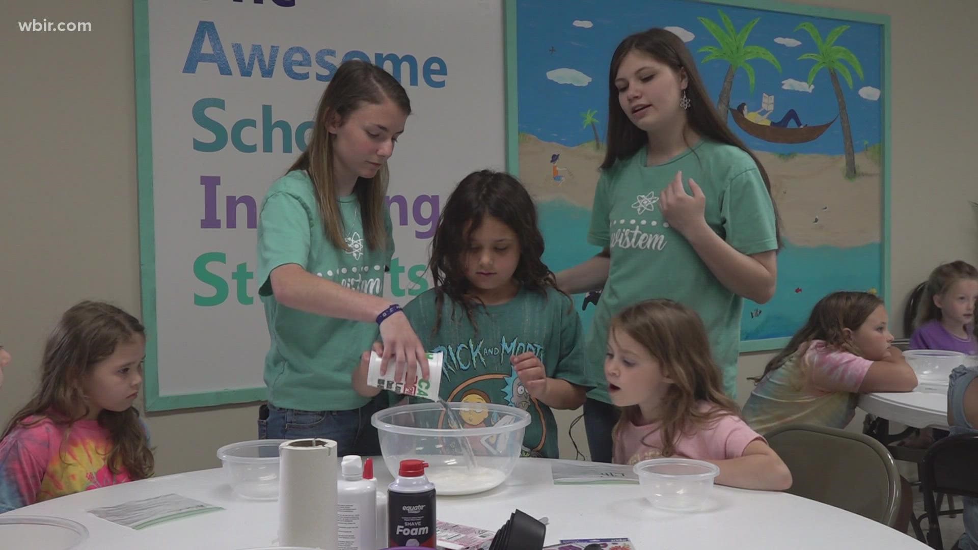 Anderson County High School students visited Lake City Elementary to make slime with the young girls, showing them some principles of science.
