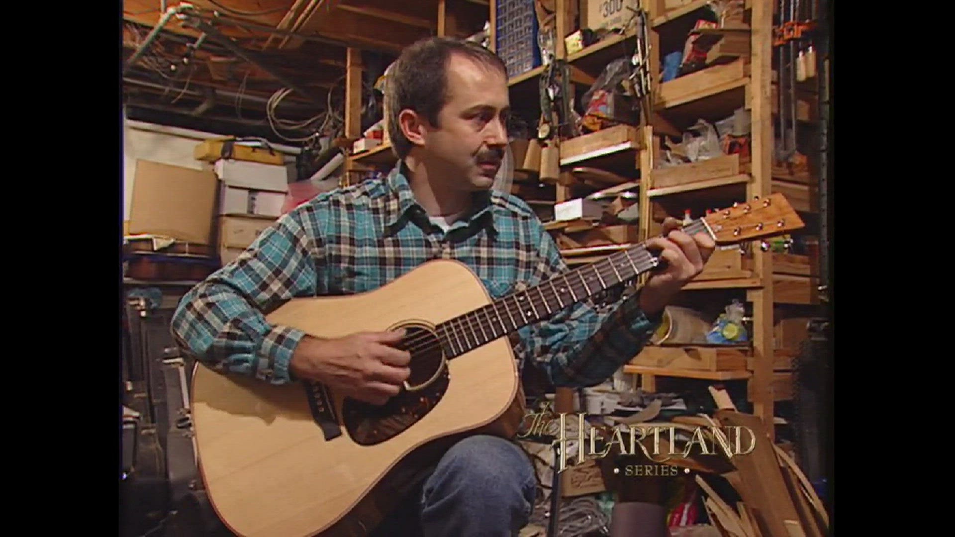 The final touch to all of luthier John Arnold's guitars is a song.