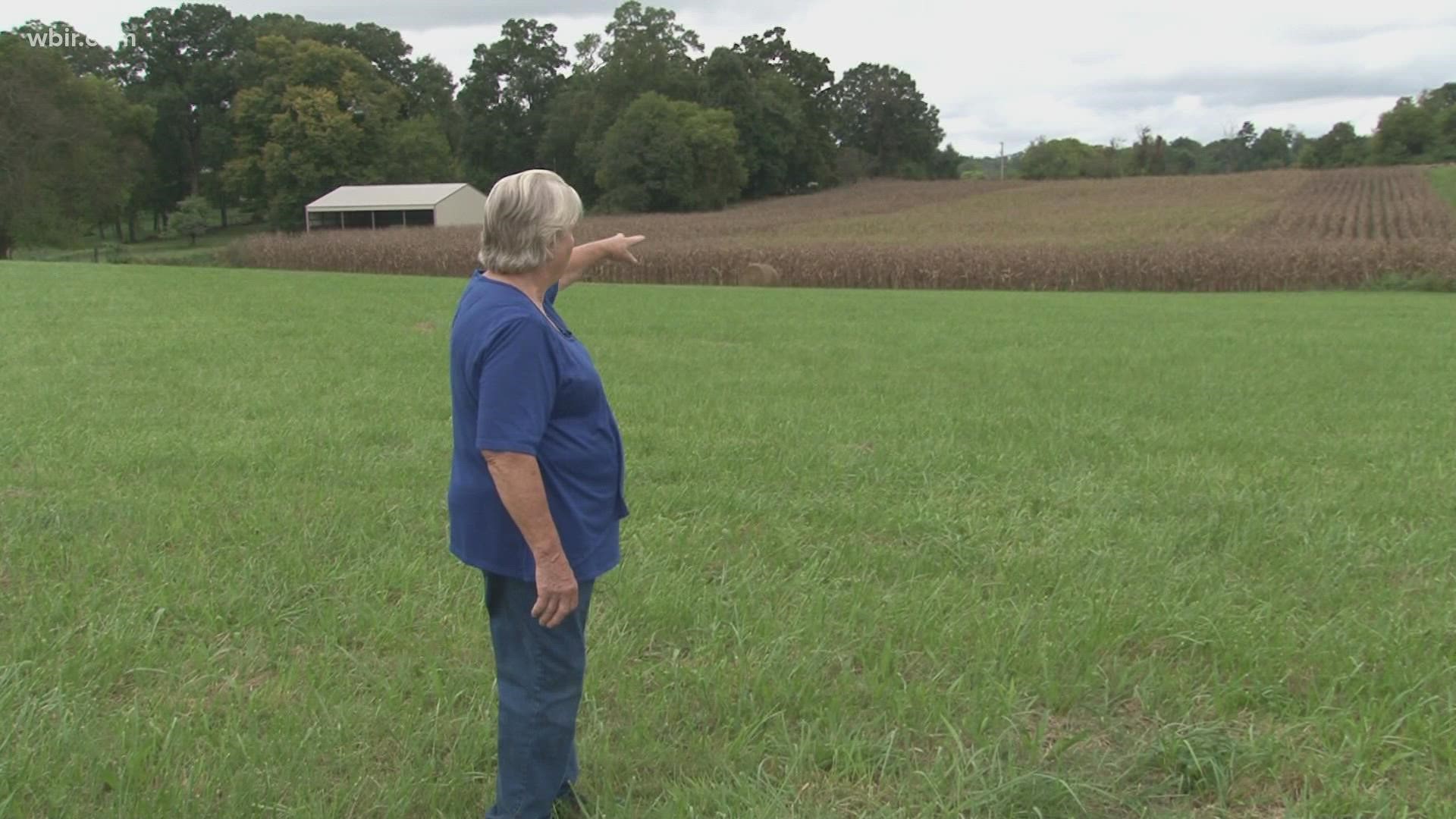 The proposed designs would take the highway through people's property, including 2,324 acres of one woman's farmland