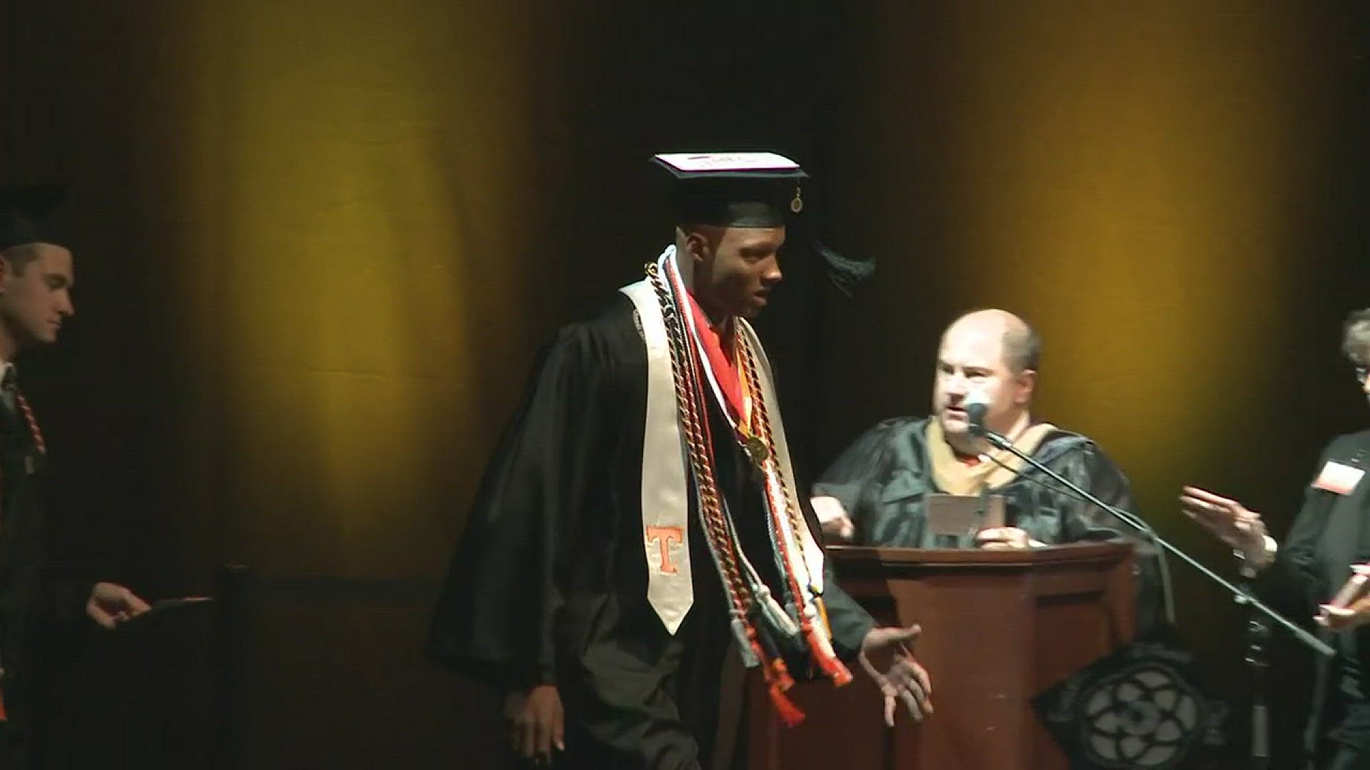 Former Vols quarterback Josh Dobbs walks across the stage at Thompson-Boling to receive his degree.