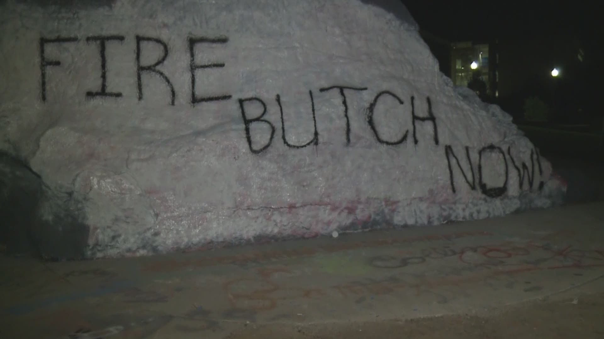 The rock on UT's campus was painted white overnight and someone wrote 'FIRE BUTCH NOW' on it. However, that didn't last long. By 1 p.m. Tuesday, it was already painted over.