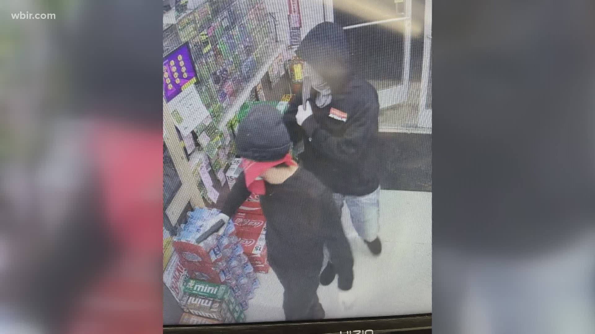 One pointed a gun at the clerk and demanded money.  The suspects loaded the money into a gray duffel bag and fled on foot behind the store, according to police.