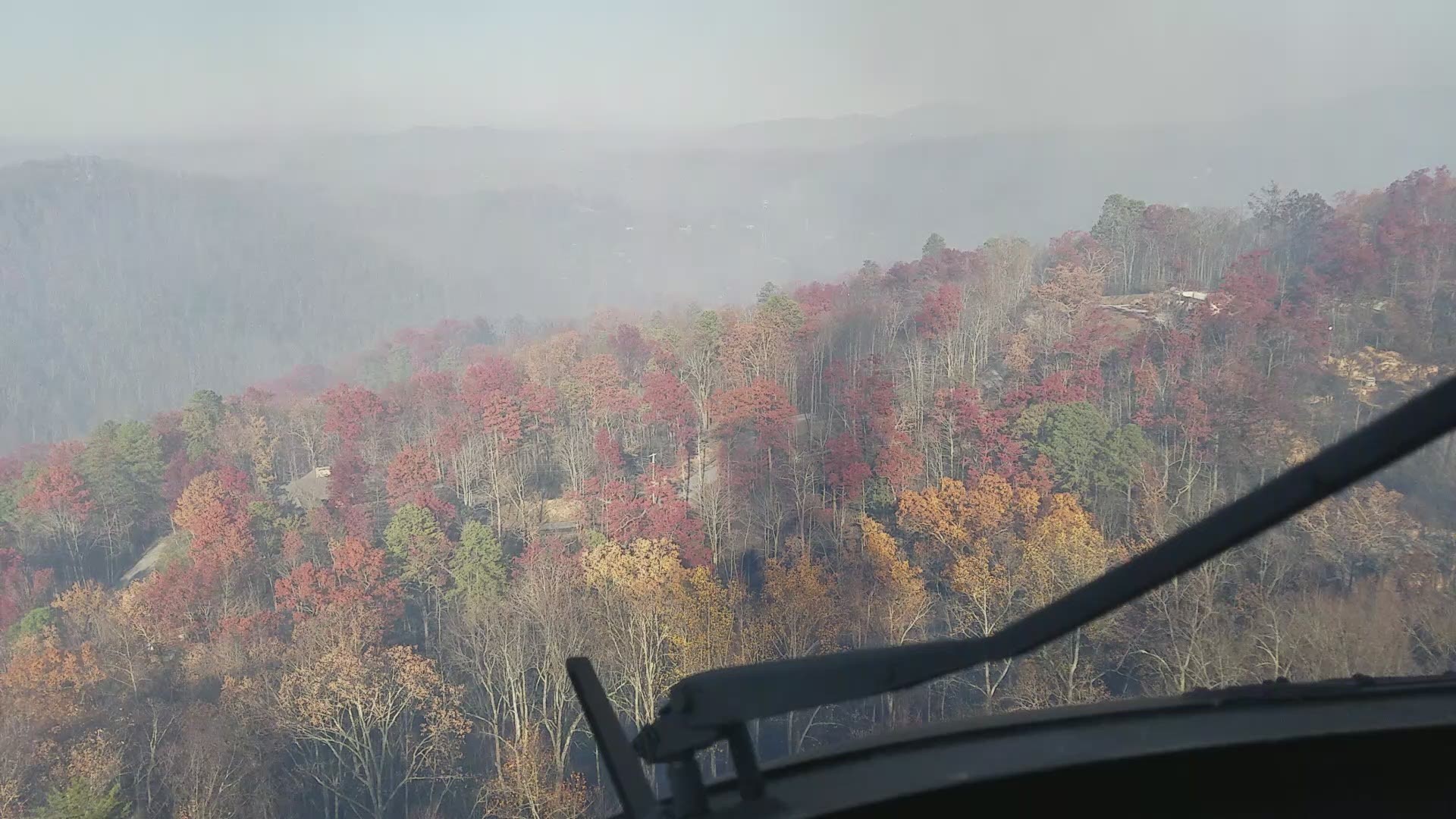 View from the cockpit of Black Hawk as pilots make bucket drops on structure/wildfire. Courtesy: Tennessee Army National Guard