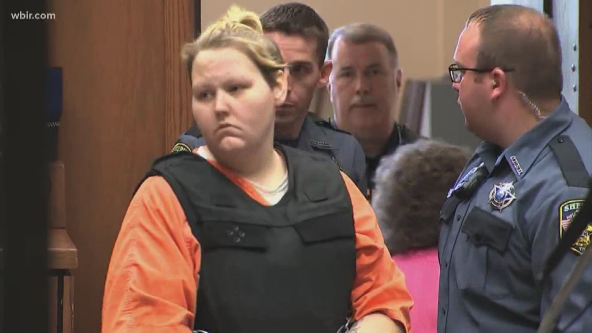 Authorities say Krystal Daniels admitted to being home when her husband, Joseph Ray Daniels, killed their son.