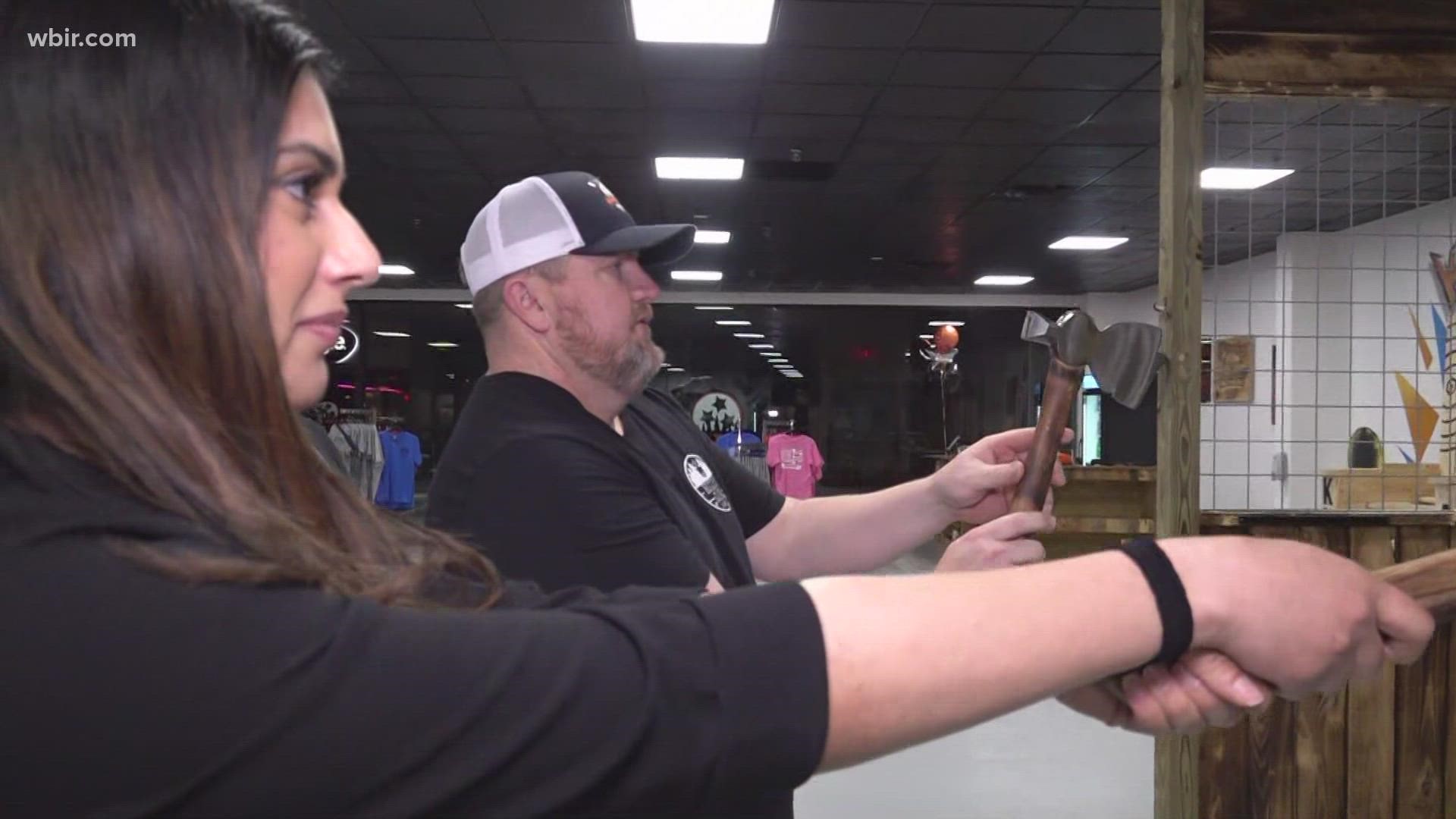 10News reporter Raya Quttaineh checks out a new axe throwing spot that opened in West Town Mall.