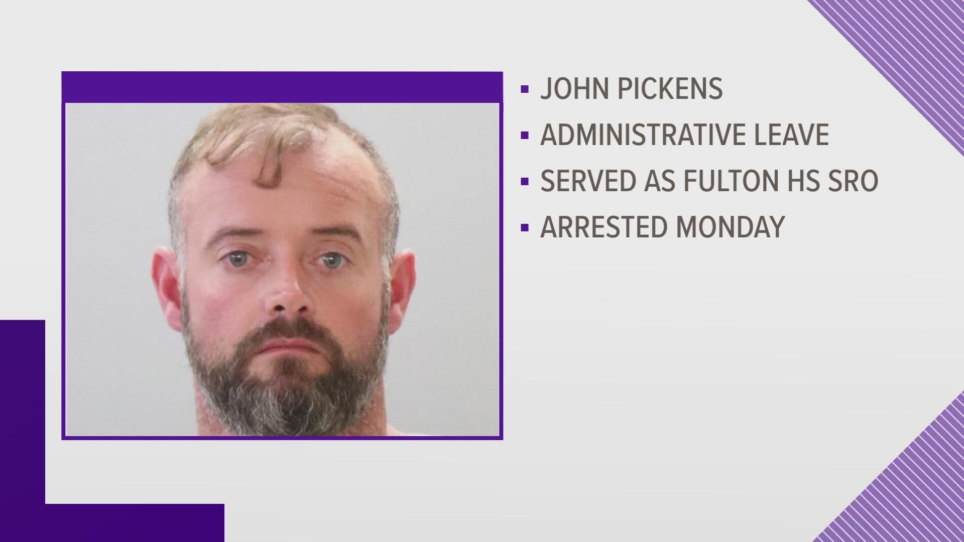 Officer John Pickens was taken into custody by the Knox County Sheriff's Office at Knoxville Police Department headquarters on Monday.