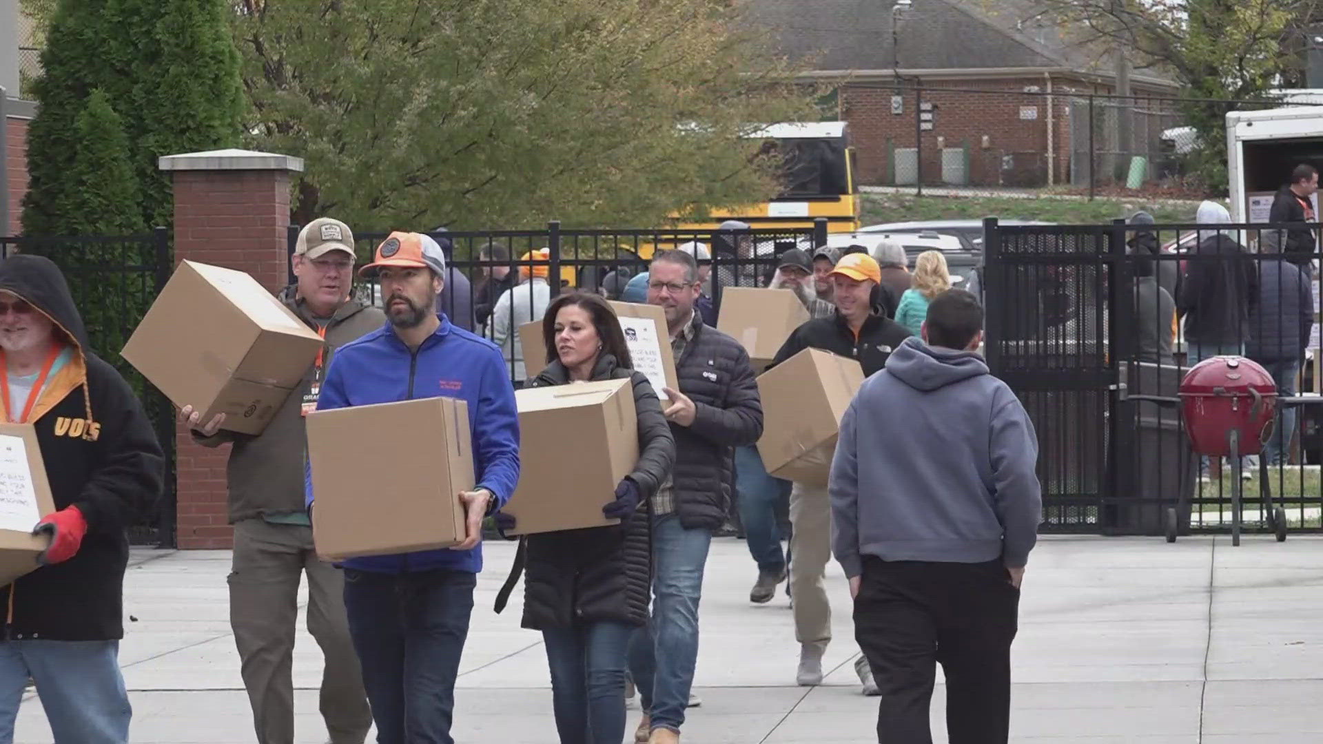 Workers with the Grace Baptist Church handed out boxes of food at the Boys and Girls Club to support families in need before the Thanksgiving holiday.